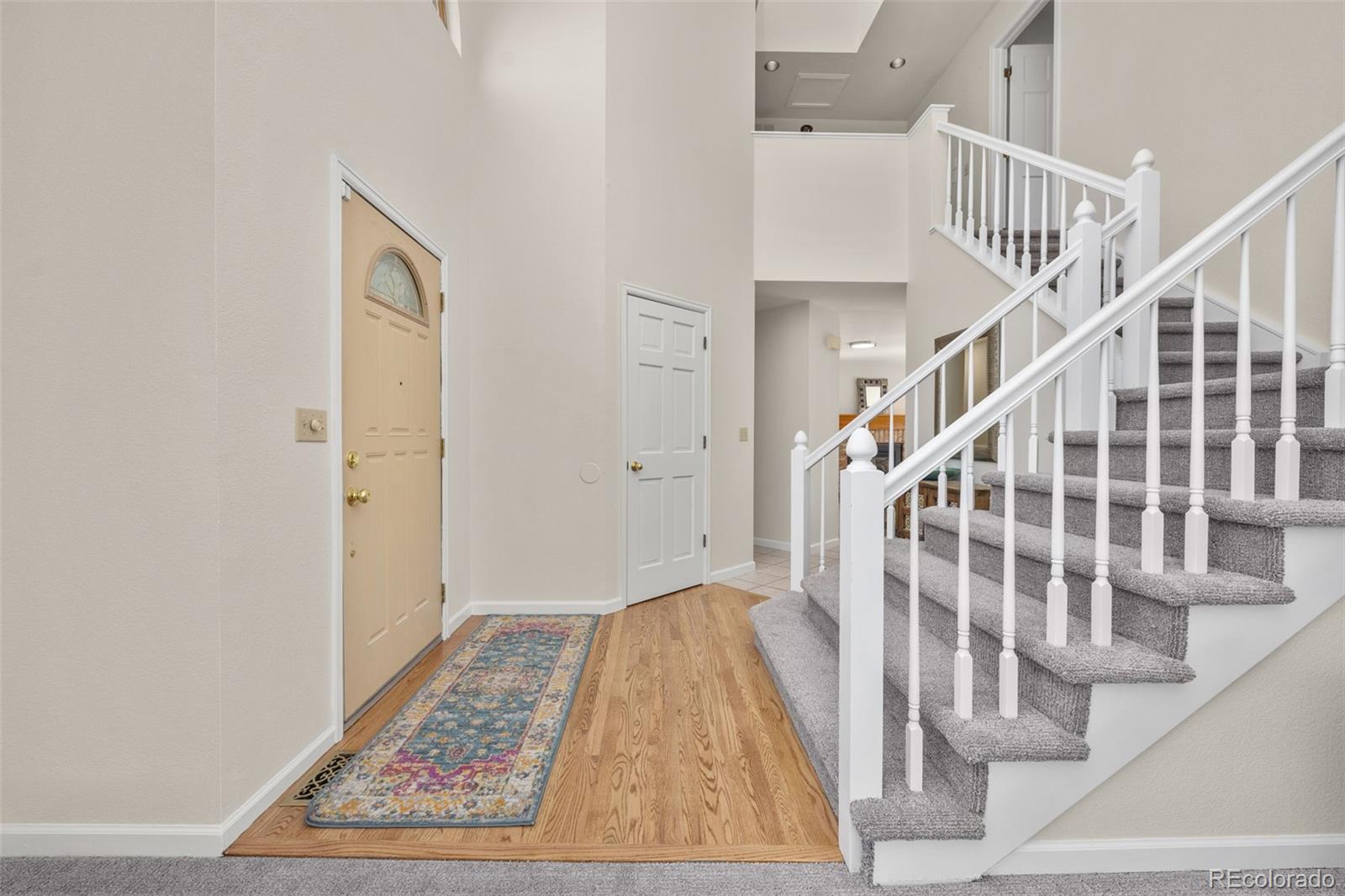 6868 Johnson Street Arvada, CO 80004 - Photo 3 of 39 a view of entryway with wooden floor