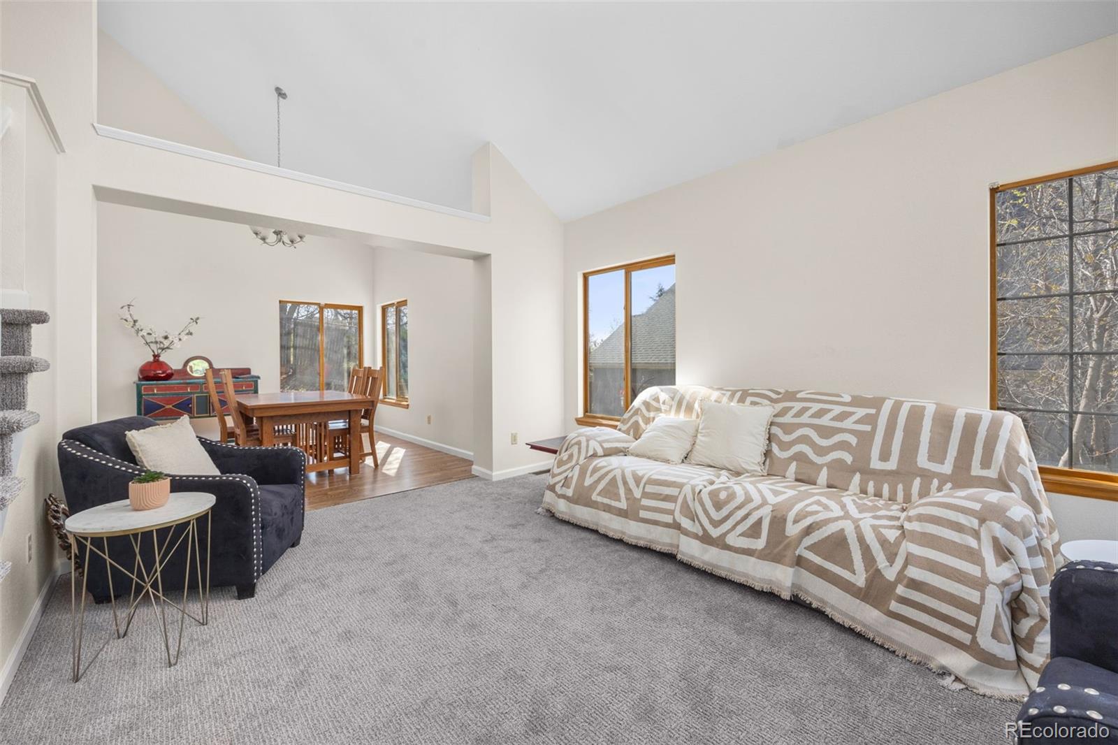 6868 Johnson Street Arvada, CO 80004 - Photo 4 of 39 a living room with furniture and a large window
