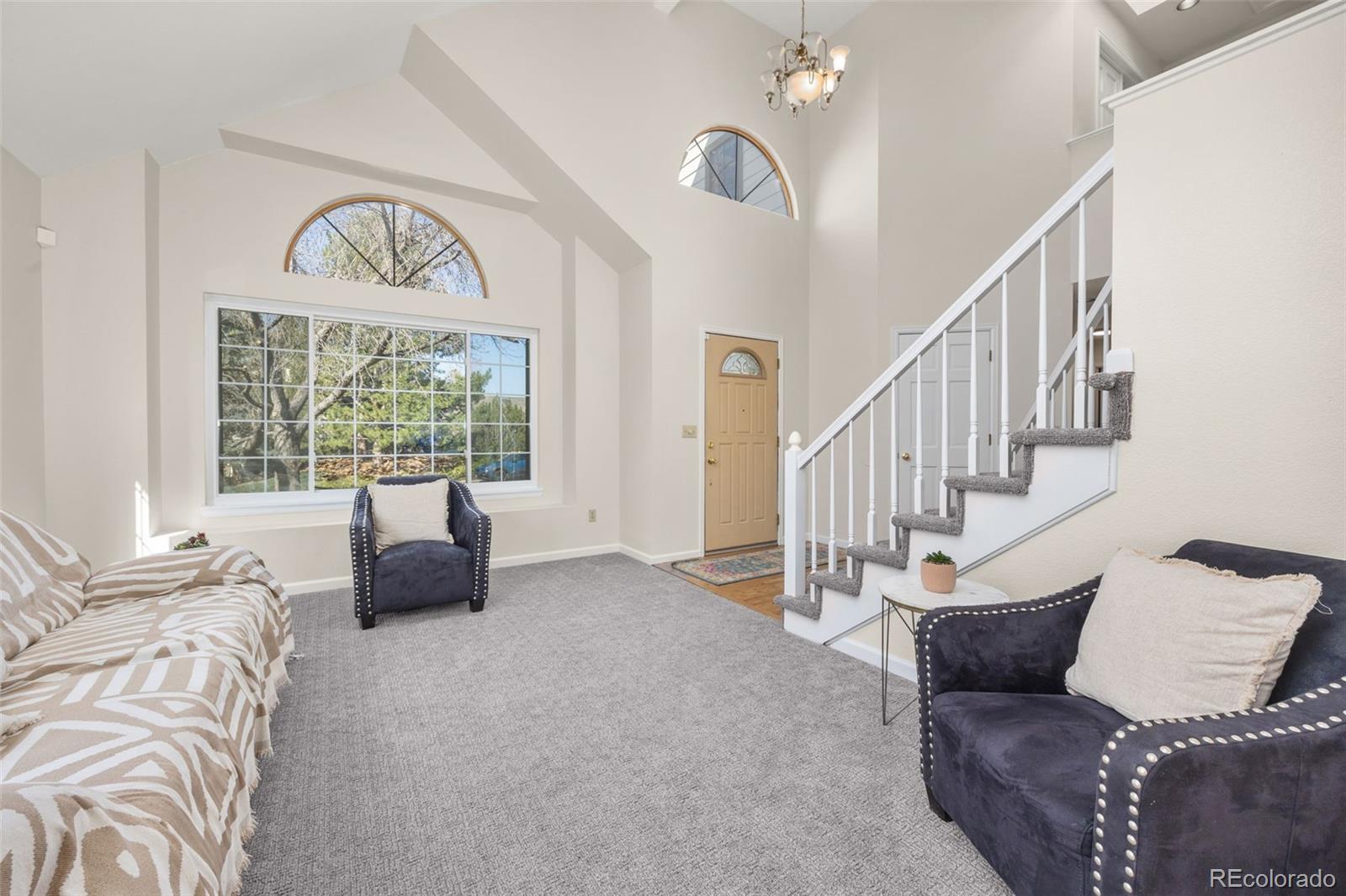 6868 Johnson Street Arvada, CO 80004 - Photo 5 of 39 a living room with furniture and a large window