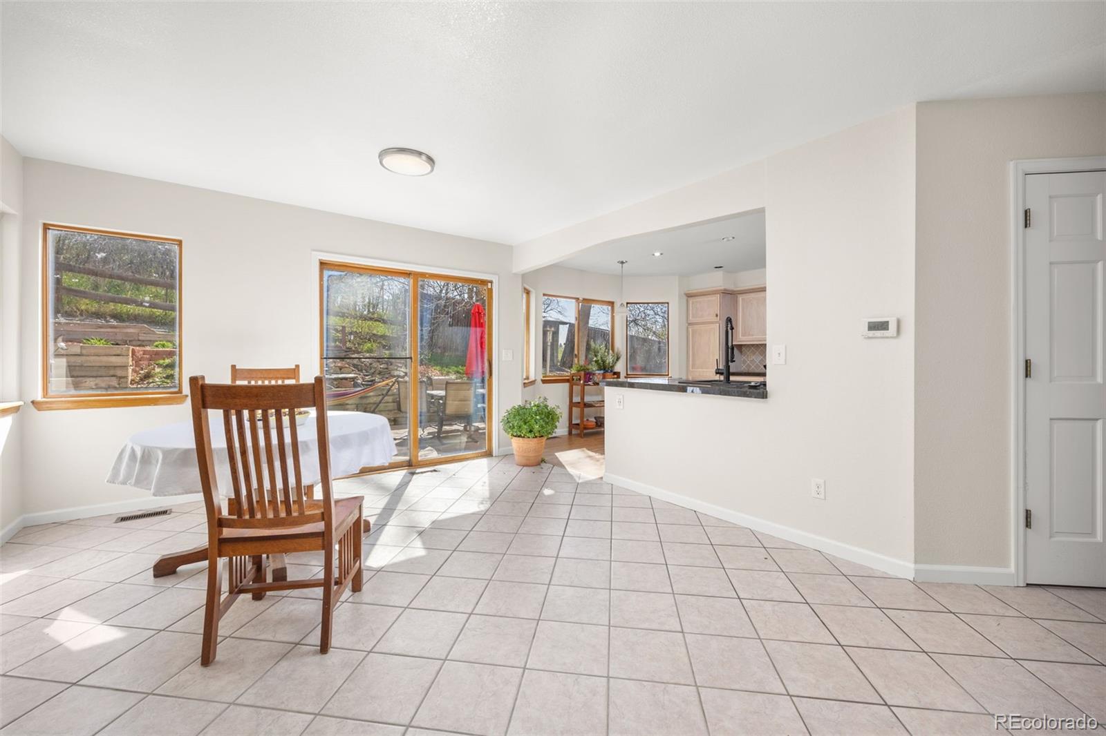 6868 Johnson Street Arvada, CO 80004 - Photo 8 of 39 a view of a livingroom with furniture and a window