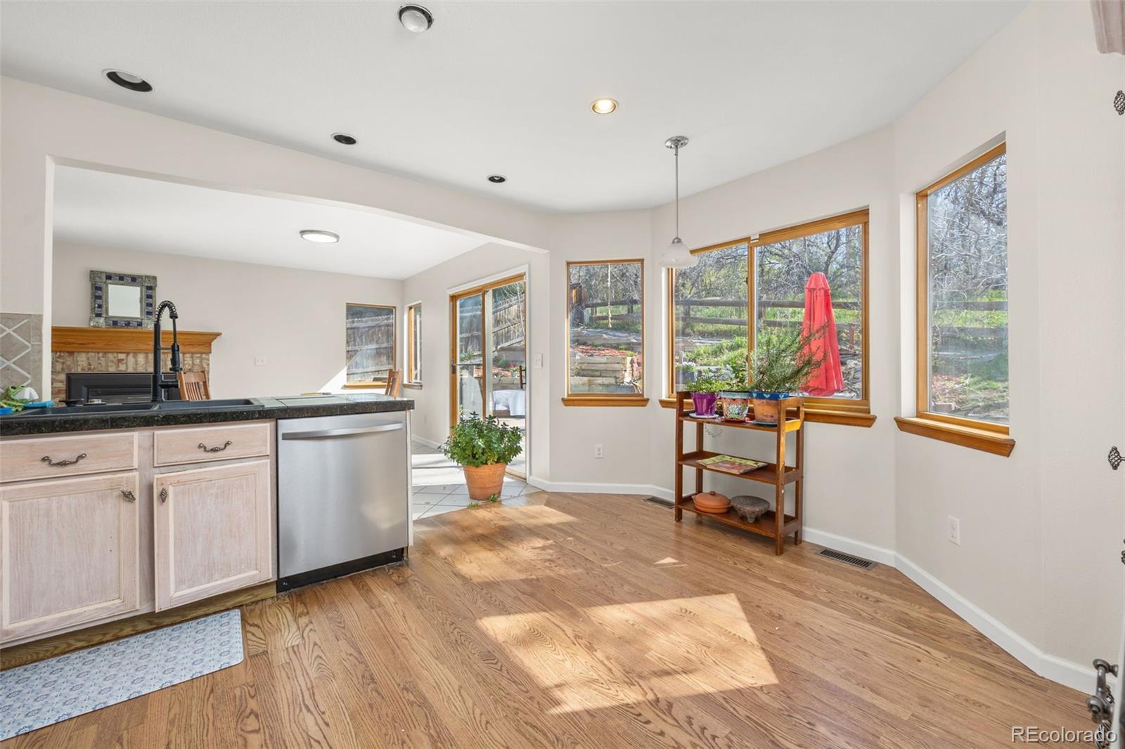 6868 Johnson Street Arvada, CO 80004 - Photo 10 of 39 a living room with granite countertop furniture and a flat screen tv
