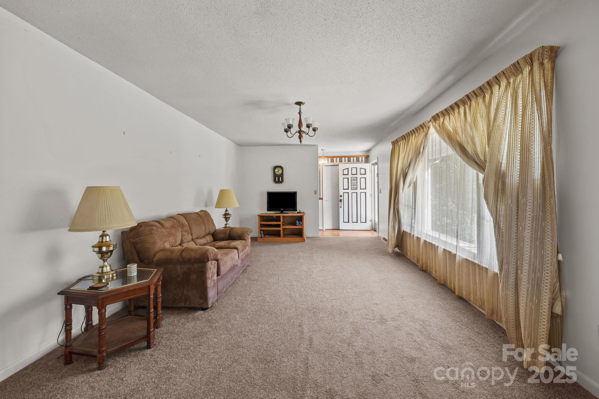 2440 Emanuel Church Road Rockwell, NC 28138 - Photo 11 of 41 a living room with furniture and a large window