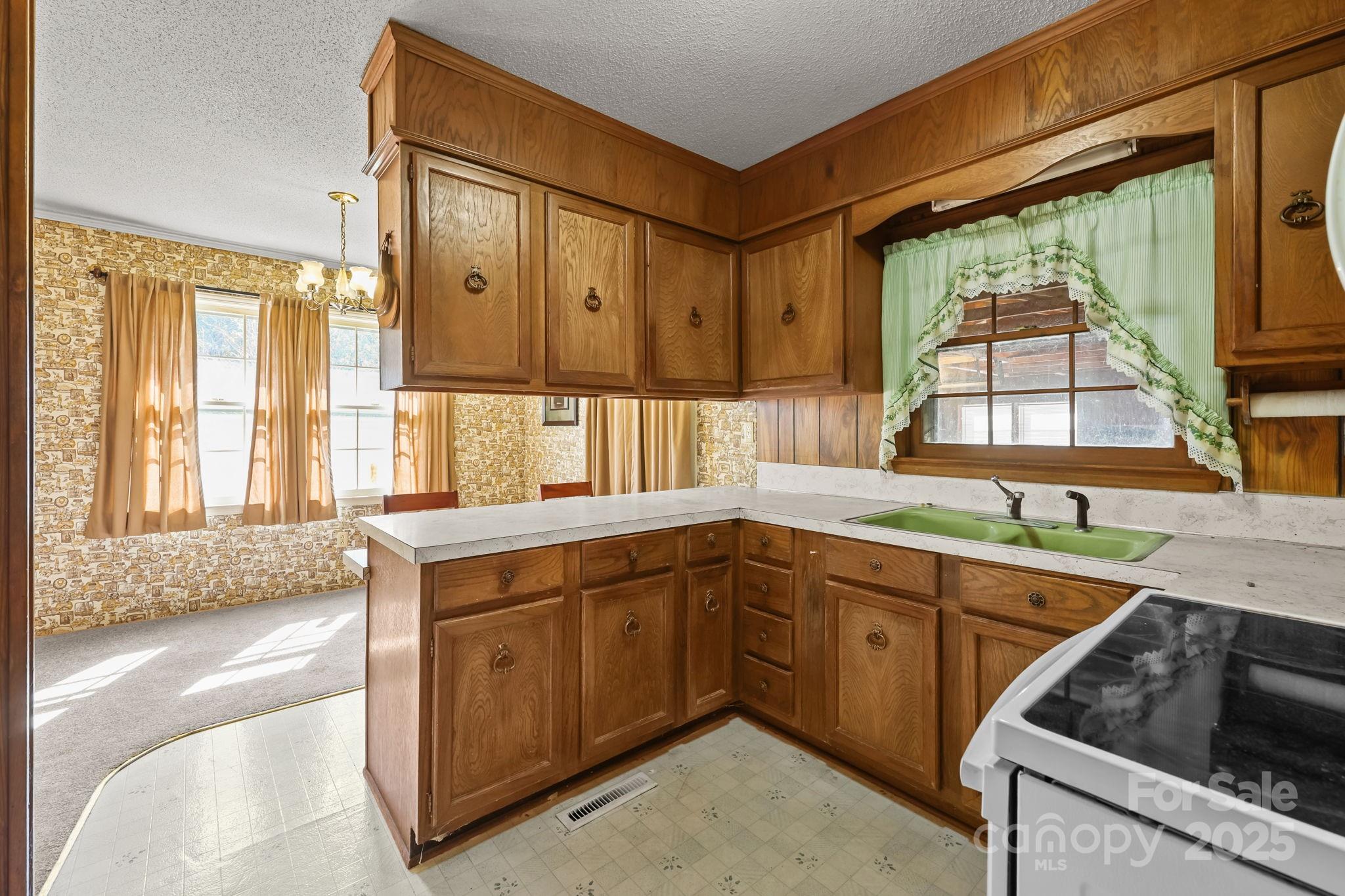 2440 Emanuel Church Road Rockwell, NC 28138 - Photo 17 of 41 a kitchen with a sink and large window