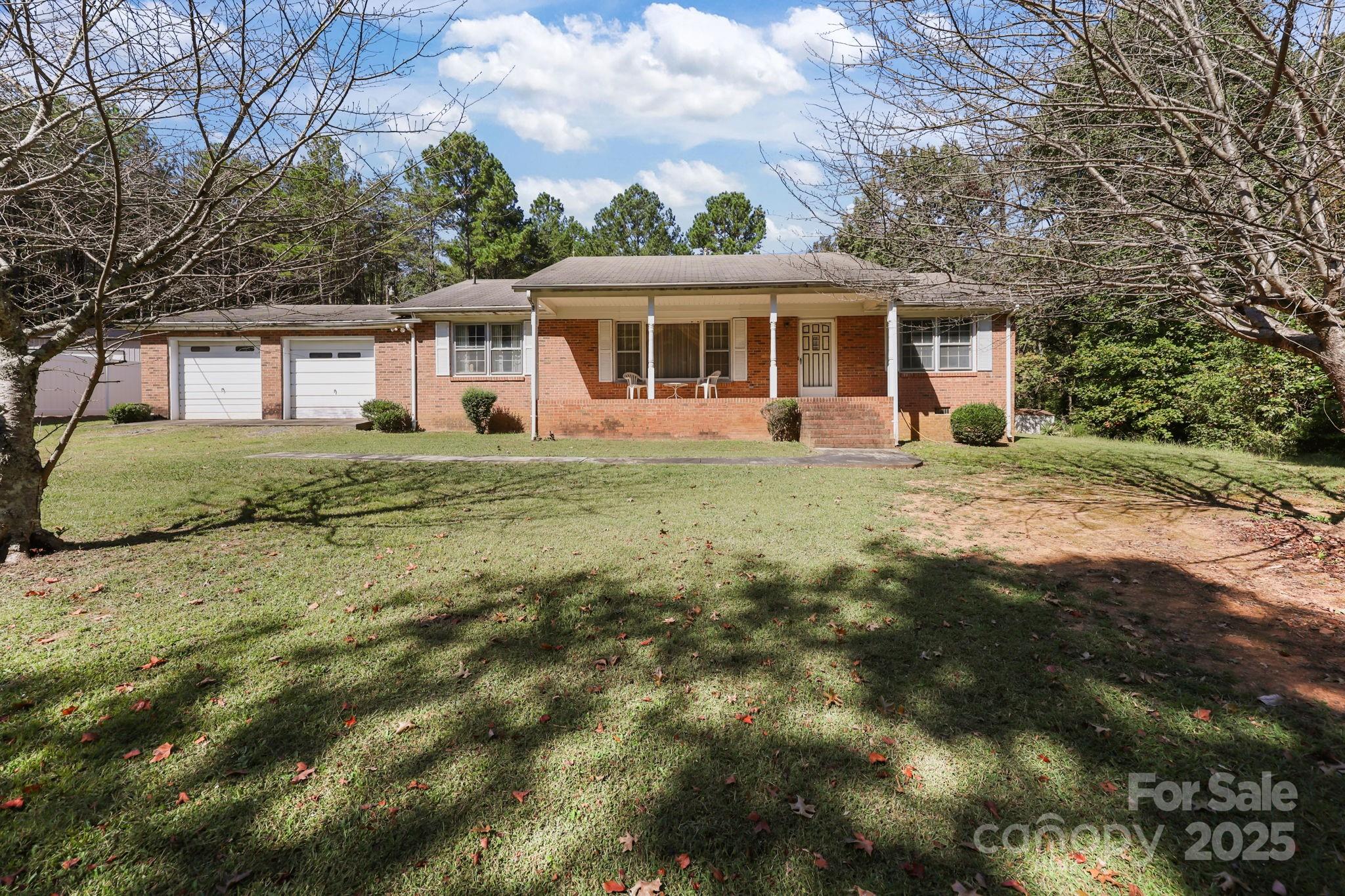 2440 Emanuel Church Road Rockwell, NC 28138 - Photo 2 of 41 a front view of a house with garden