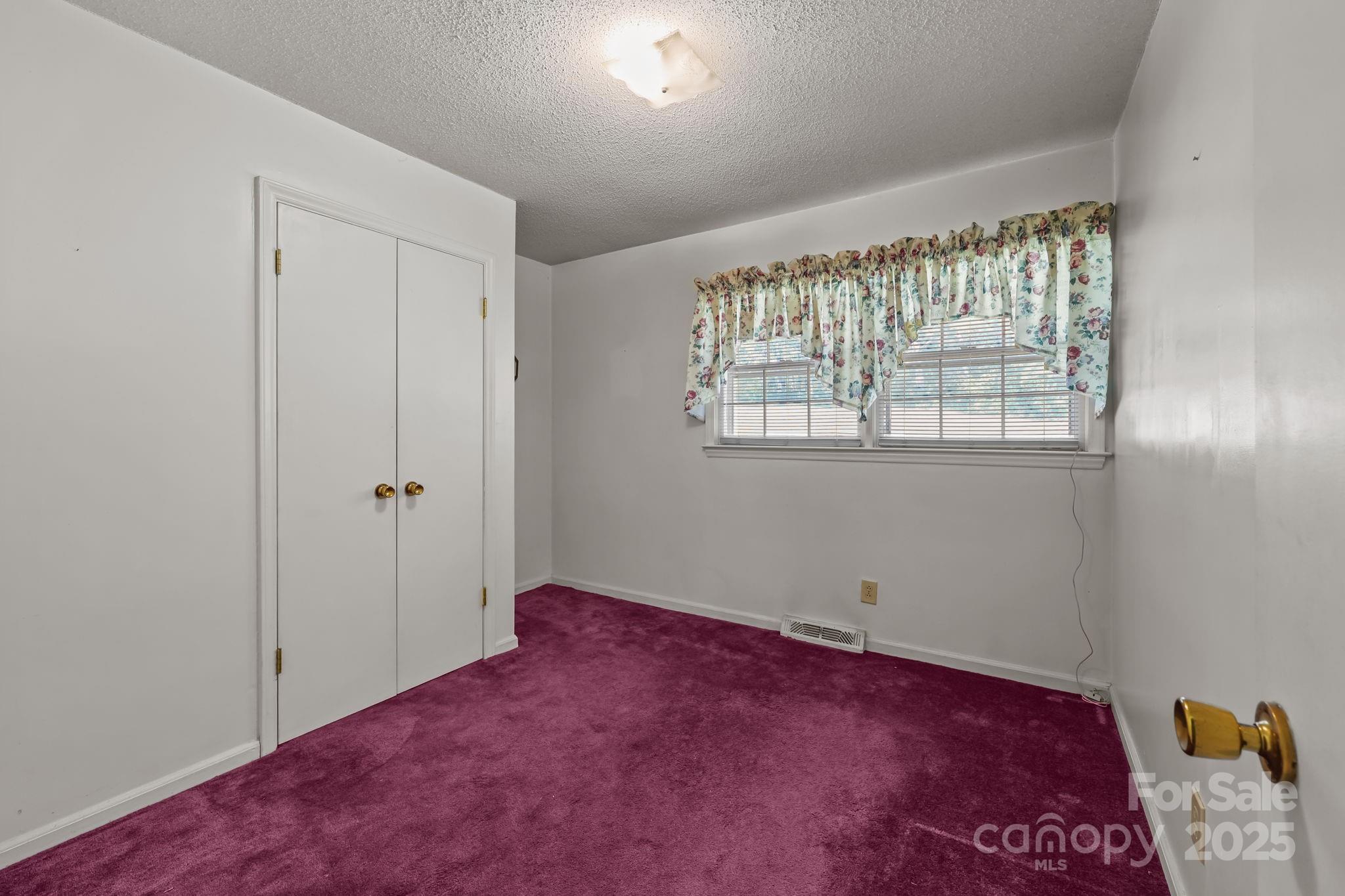 2440 Emanuel Church Road Rockwell, NC 28138 - Photo 21 of 41 a view of an empty room with a window