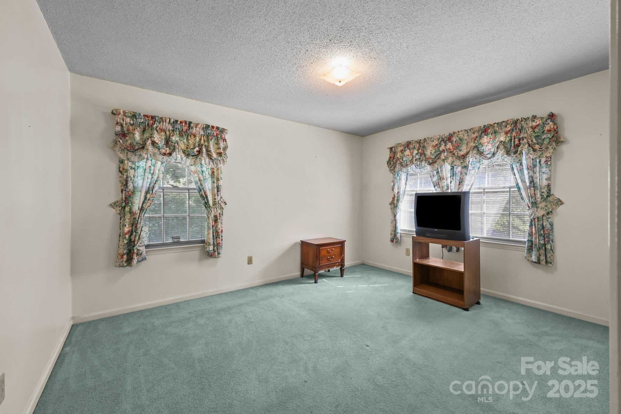 2440 Emanuel Church Road Rockwell, NC 28138 - Photo 25 of 41 a living room with furniture and a flat screen tv