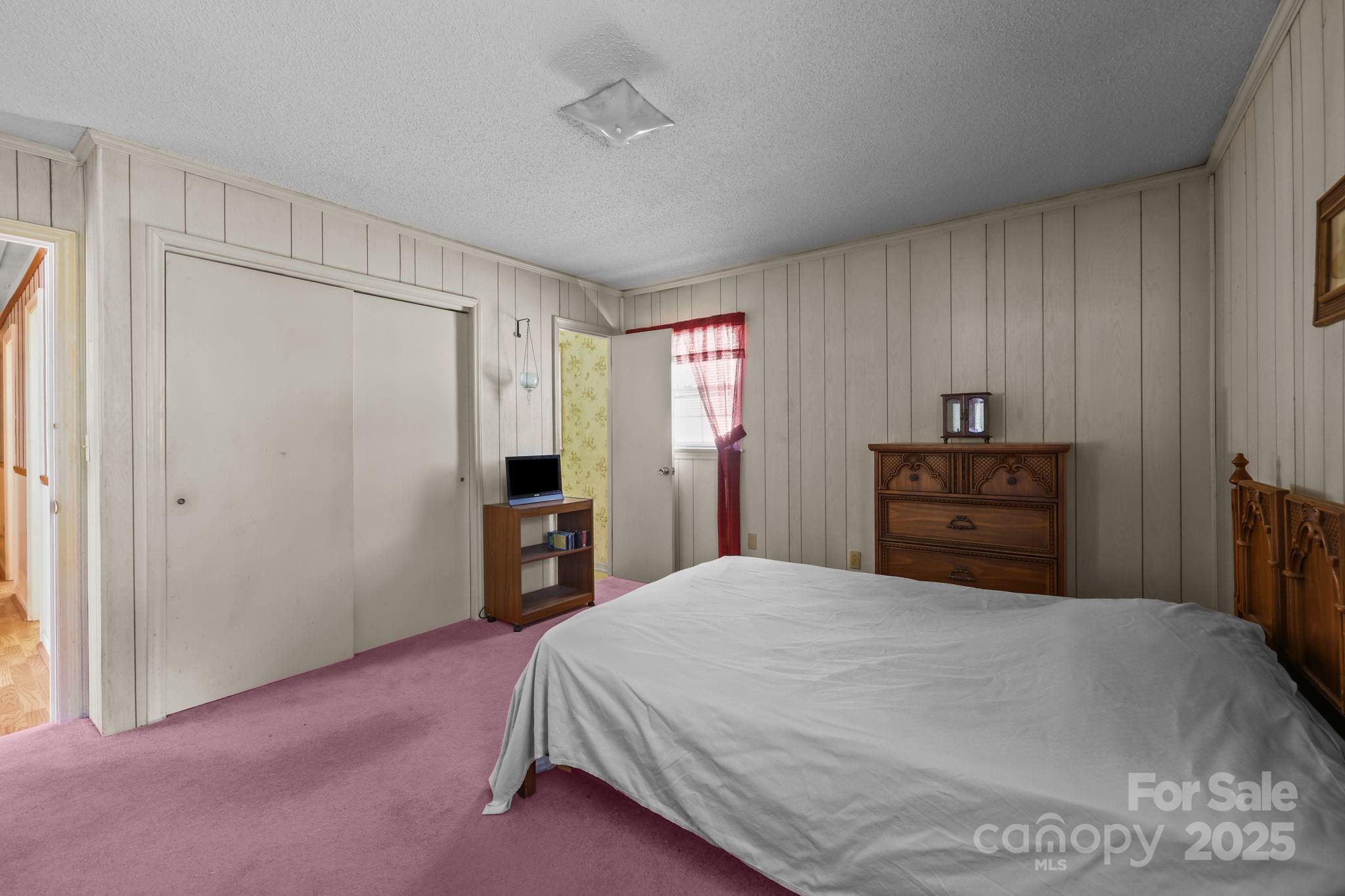 2440 Emanuel Church Road Rockwell, NC 28138 - Photo 28 of 41 a bedroom with a bed and a closet