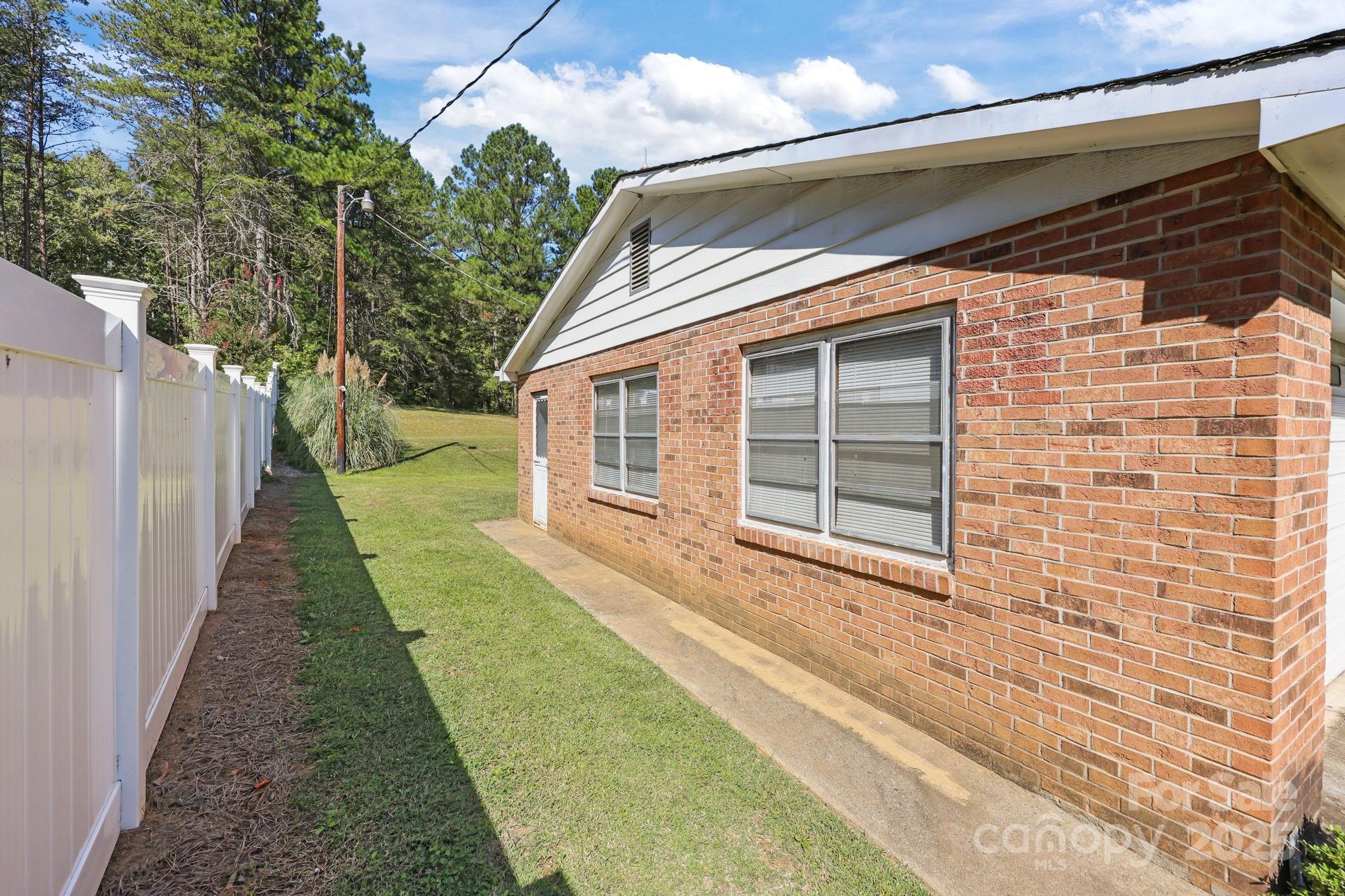 2440 Emanuel Church Road Rockwell, NC 28138 - Photo 32 of 41 a front view of a house with a yard