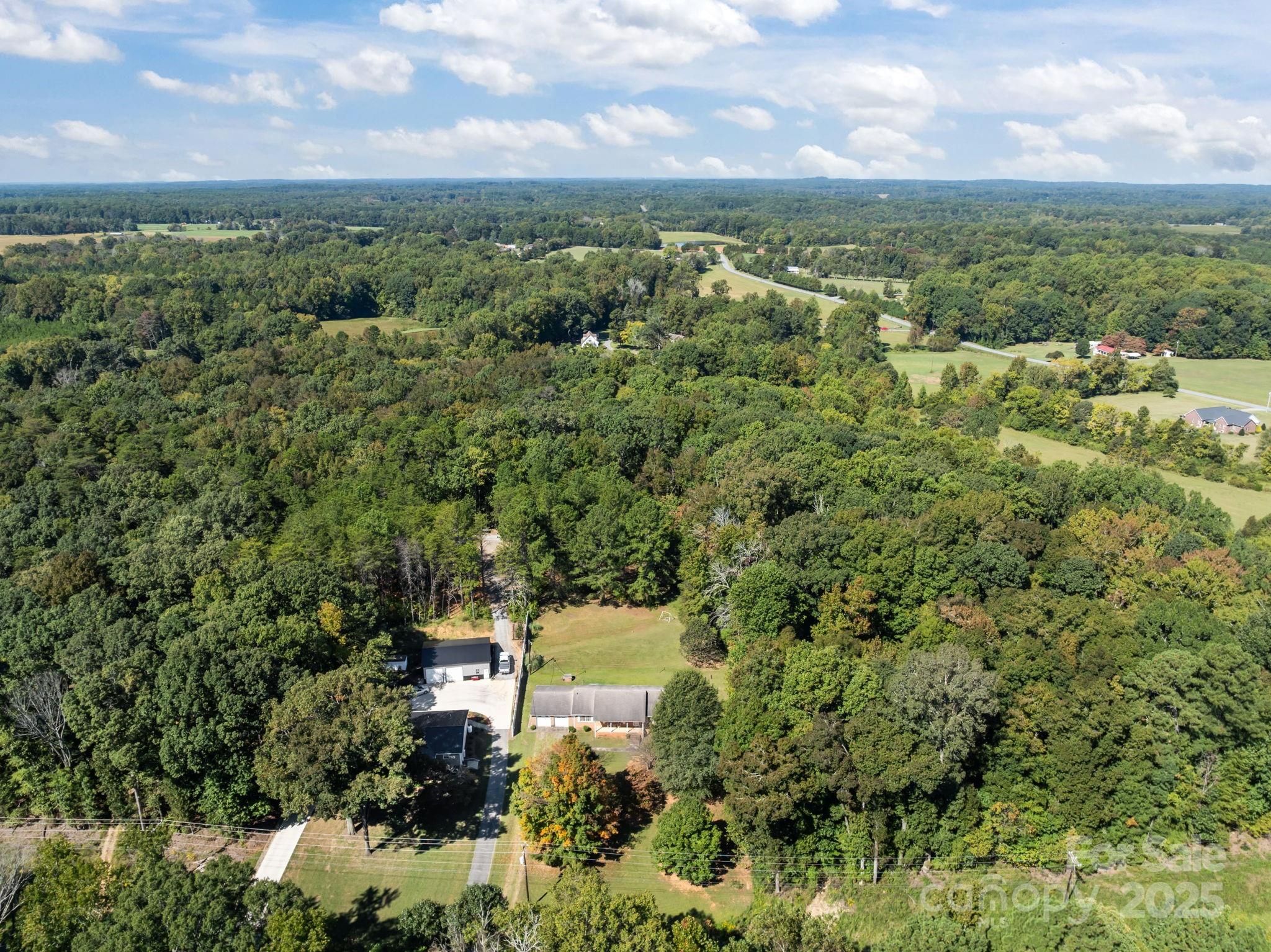2440 Emanuel Church Road Rockwell, NC 28138 - Photo 37 of 41 an aerial view of a house with a yard