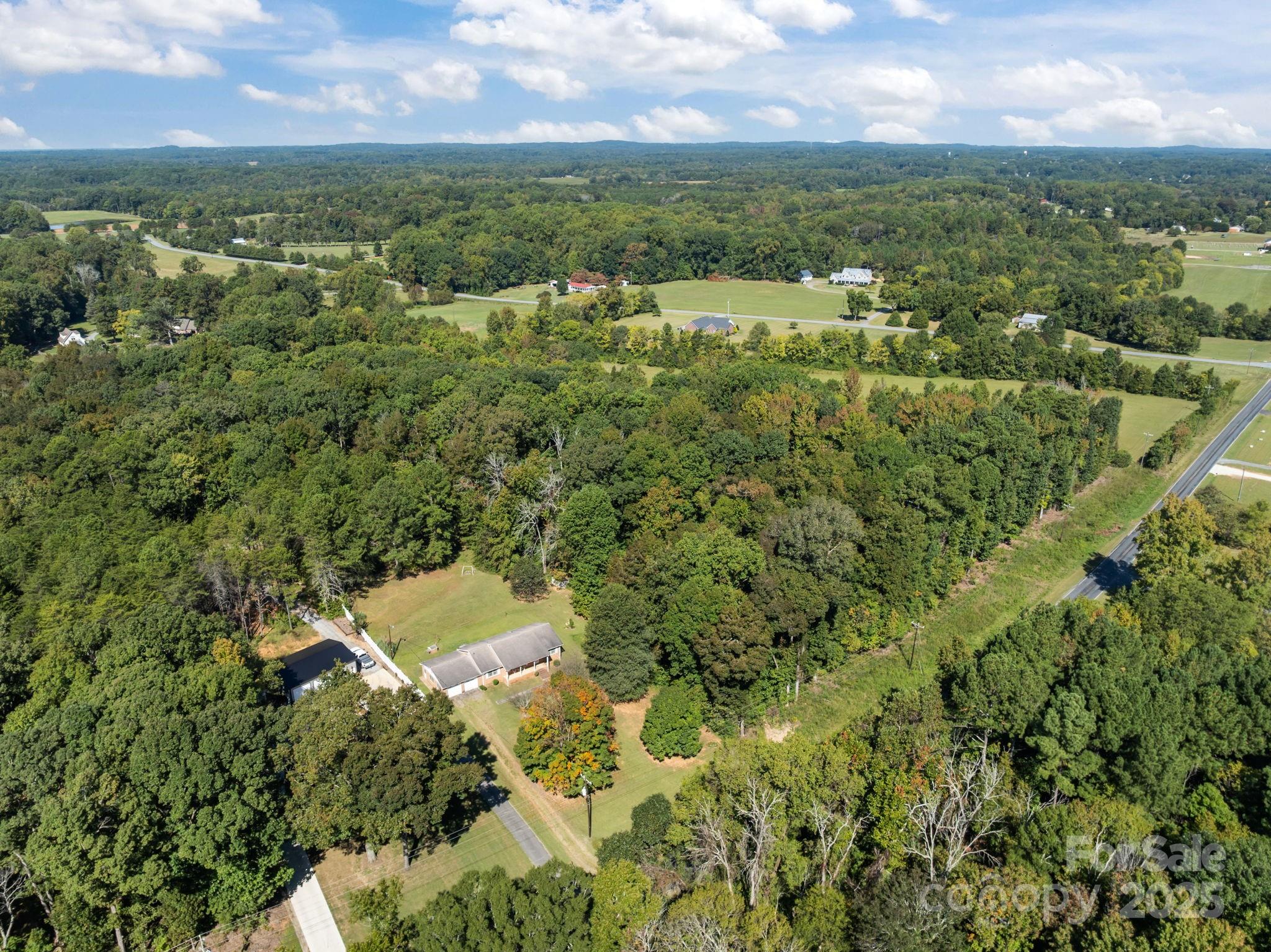 2440 Emanuel Church Road Rockwell, NC 28138 - Photo 38 of 41 an aerial view of residential houses with outdoor space and trees