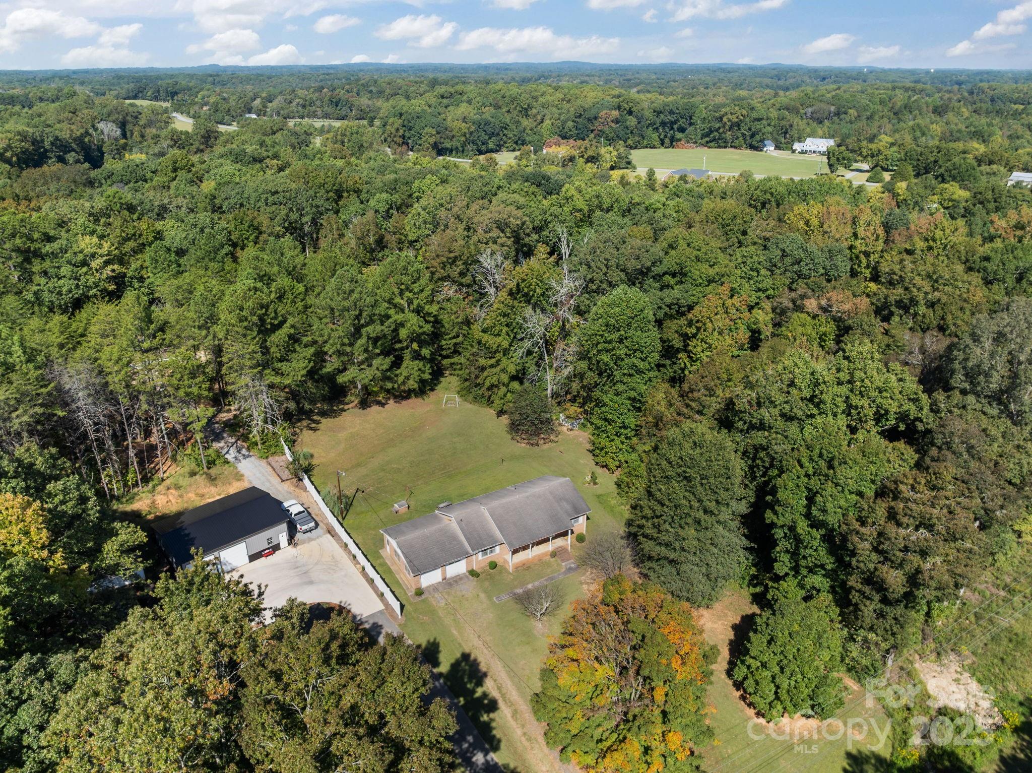 2440 Emanuel Church Road Rockwell, NC 28138 - Photo 39 of 41 an aerial view of a house with a yard