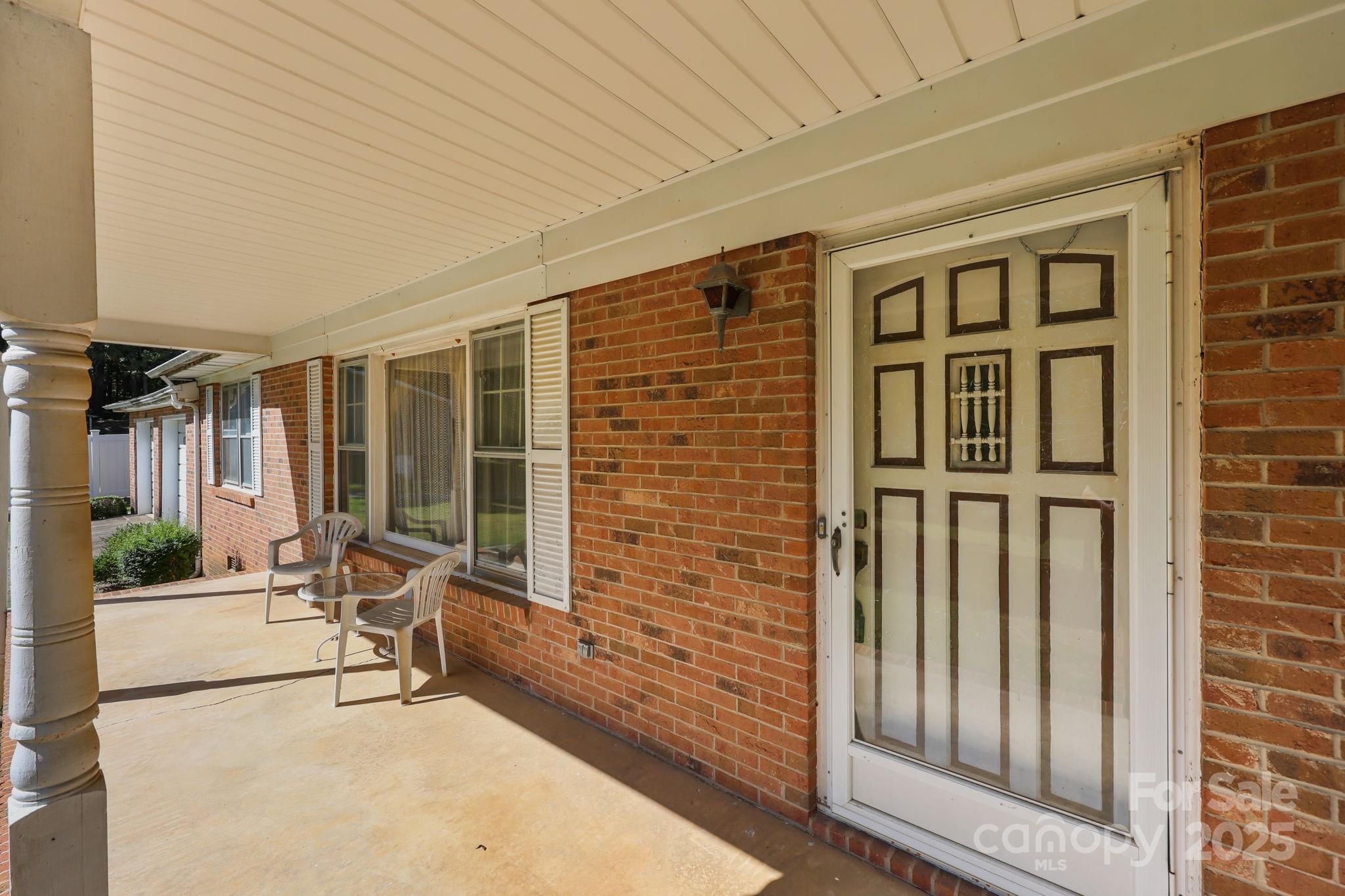 2440 Emanuel Church Road Rockwell, NC 28138 - Photo 7 of 41 a building outdoor space with patio furniture and potted plants