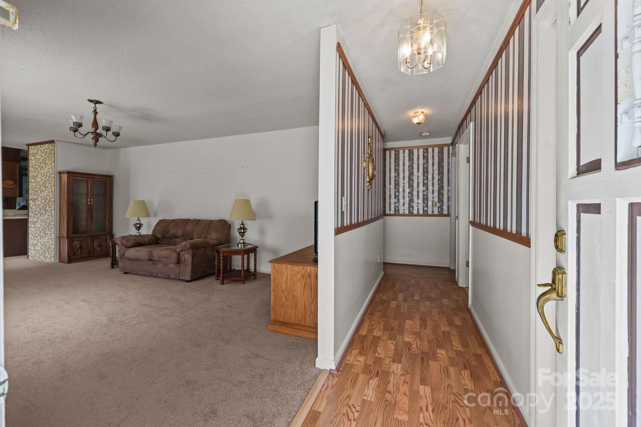 2440 Emanuel Church Road Rockwell, NC 28138 - Photo 8 of 41 a view of livingroom with furniture and chandelier