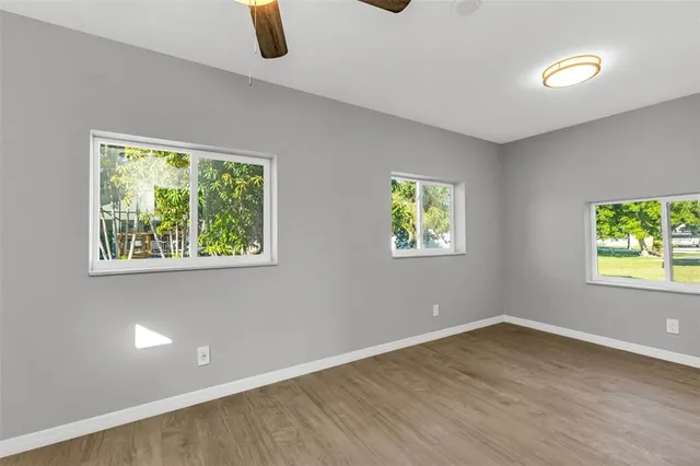a view of a room with wooden floor and staircase