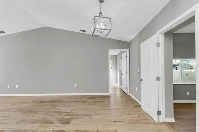 a kitchen with granite countertop a sink and cabinets