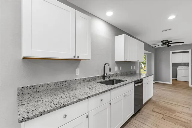 a kitchen with stainless steel appliances a refrigerator stove and microwave