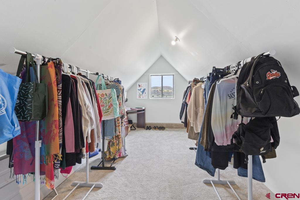 65536 Solar Road Montrose, CO 81403 - Photo 8 of 30 a view of walk in closet with clothes and shoes