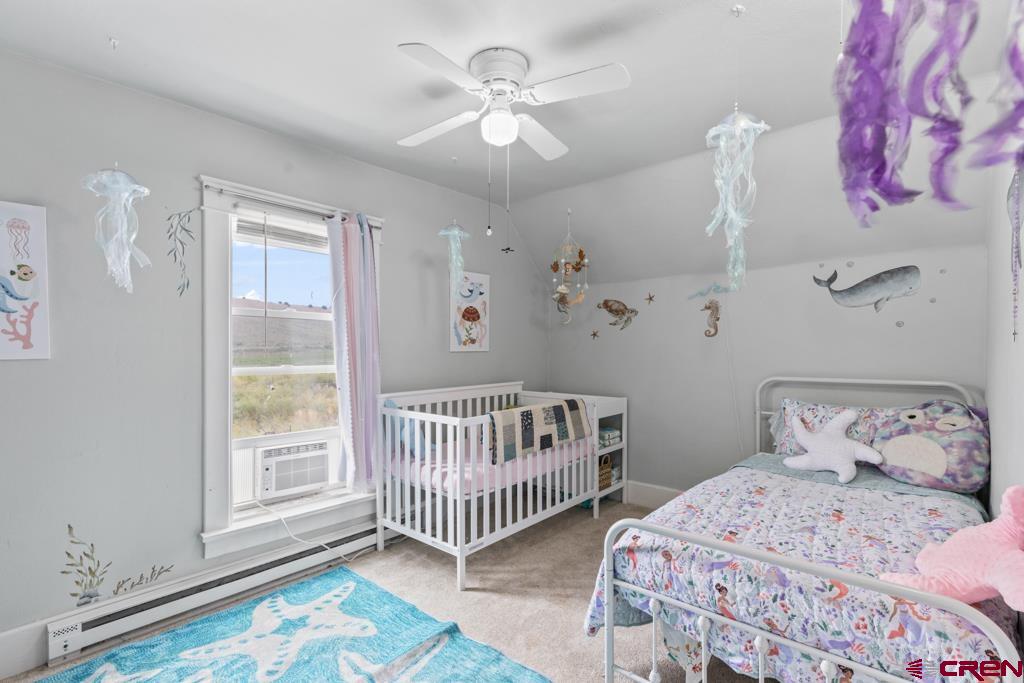 65536 Solar Road Montrose, CO 81403 - Photo 10 of 30 a bedroom with a bed and a window