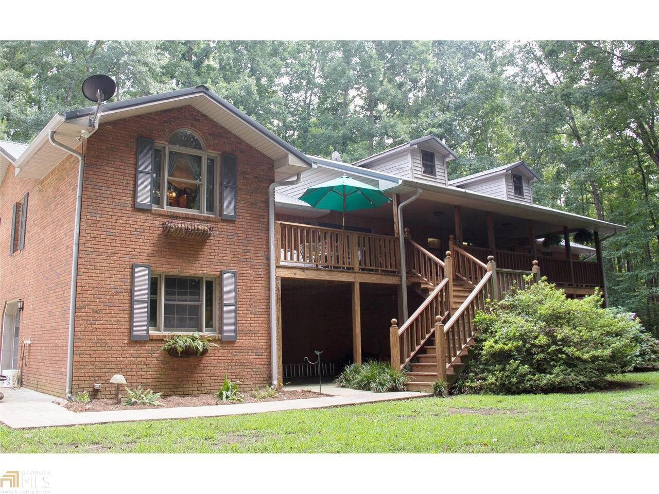 2492 Clack Road Madison, GA 30650 - Photo 1 of 1 a front view of a house with a yard