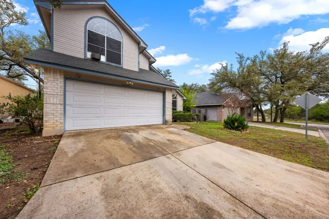 a house view with a backyard space