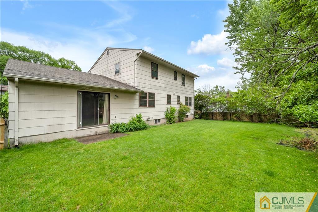 65 Dellwood Road Edison, NJ 08820 - Photo 19 of 24 a view of a house with a yard