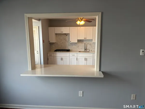 a kitchen with stainless steel appliances a sink and a stove