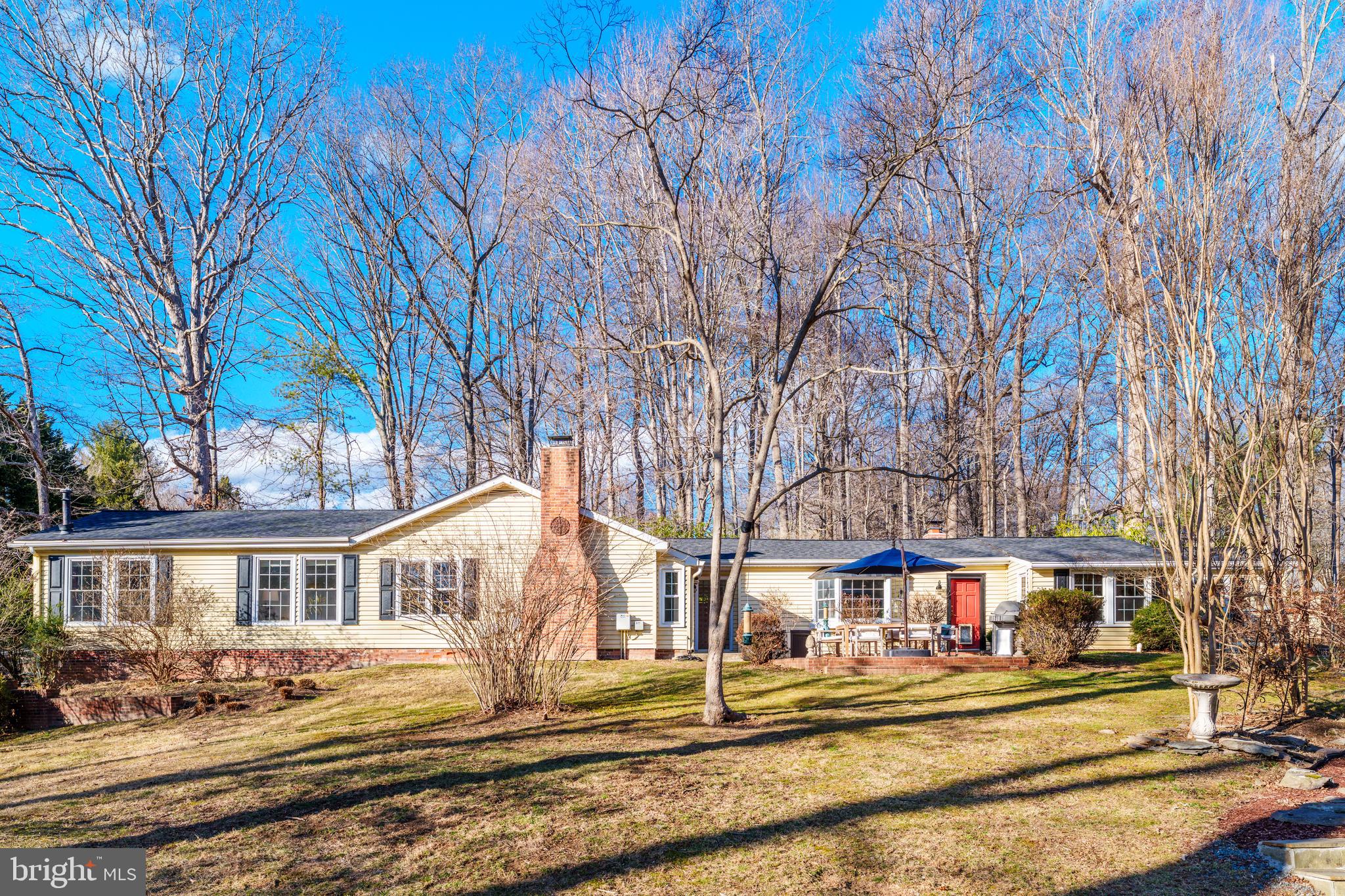 10808 Beach Mill Road Great Falls, VA 22066 - Photo 1 of 43 a front view of a house with a yard