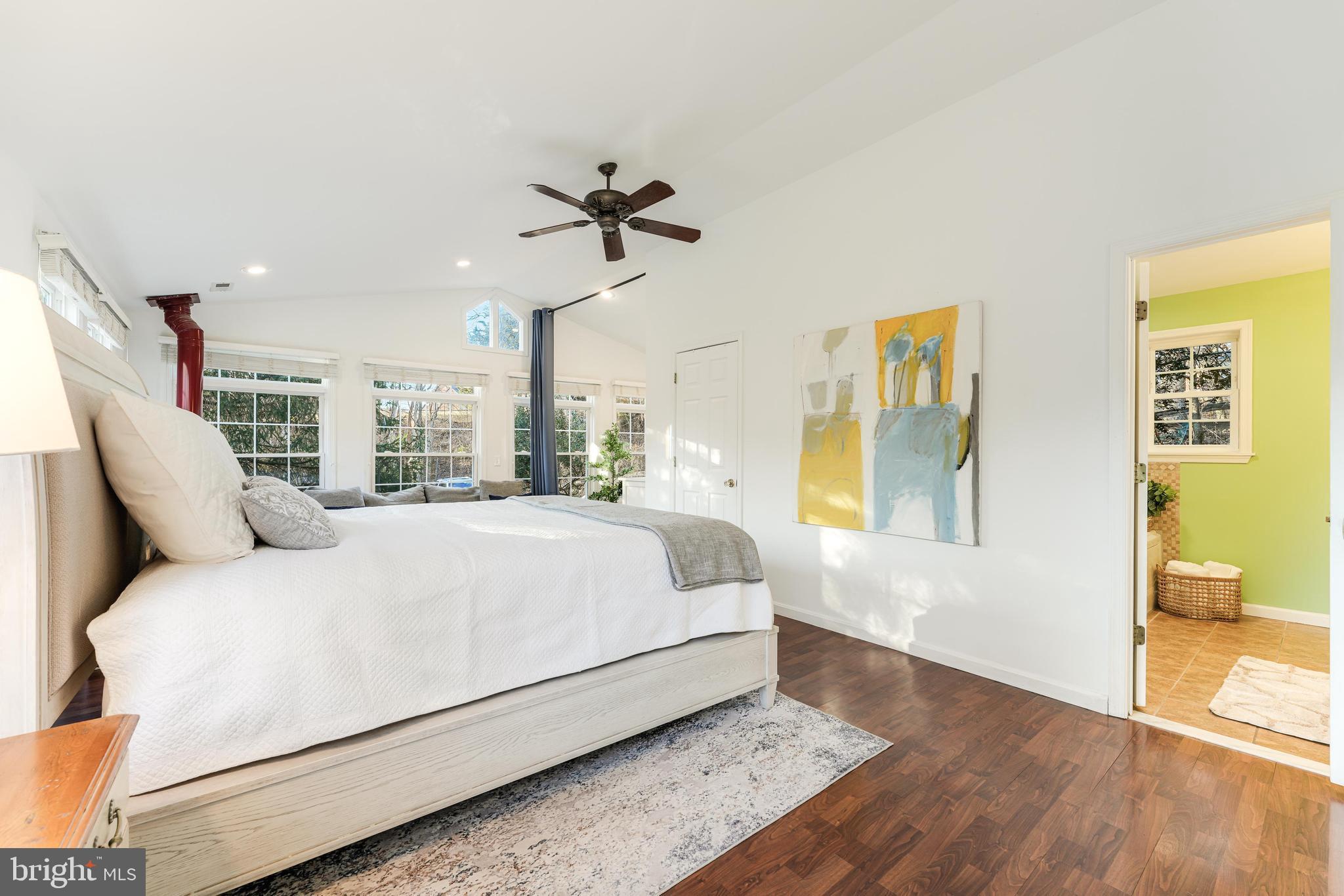 10808 Beach Mill Road Great Falls, VA 22066 - Photo 18 of 43 a large white bed in a white room
