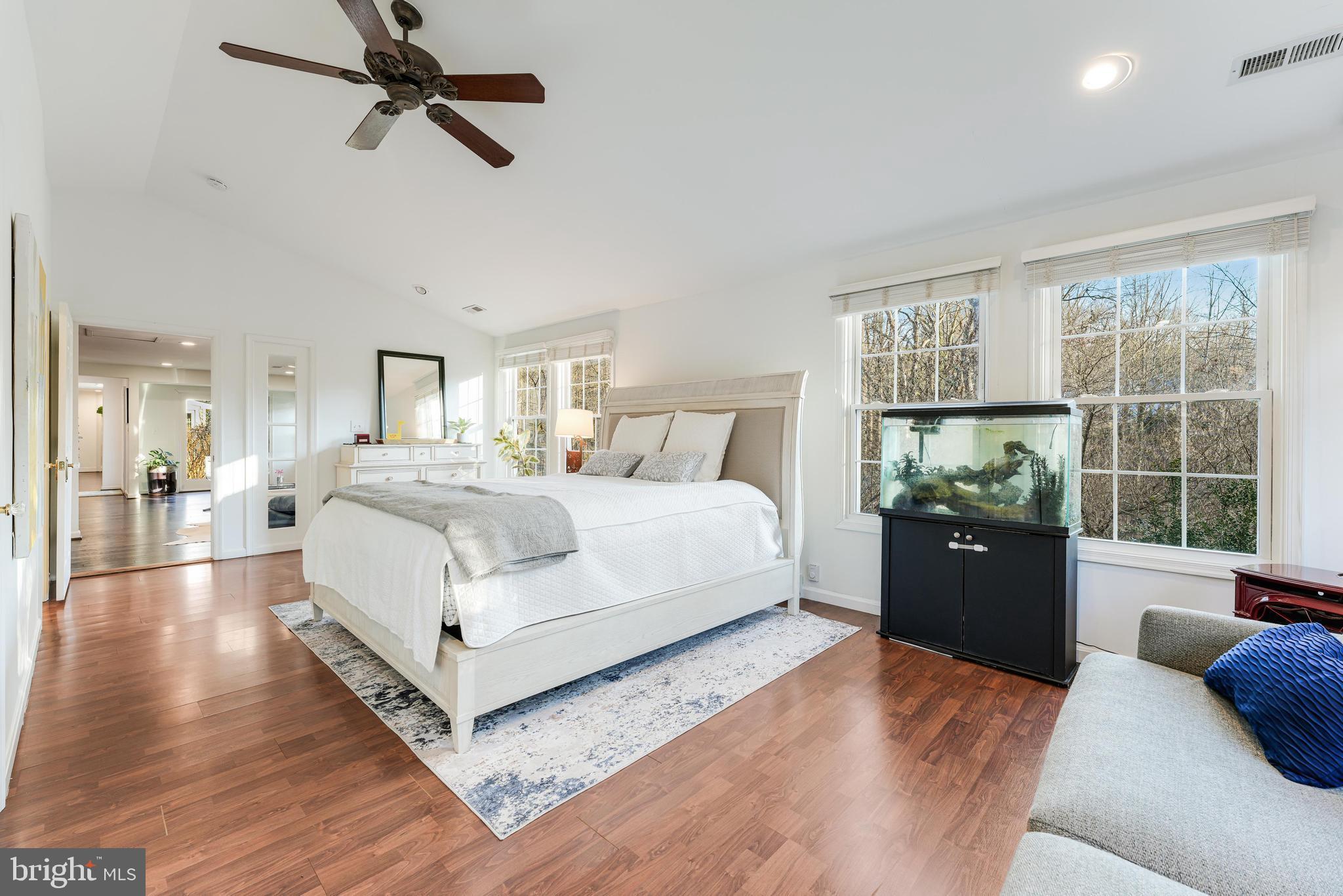 10808 Beach Mill Road Great Falls, VA 22066 - Photo 19 of 43 a bedroom with a large bed and a window
