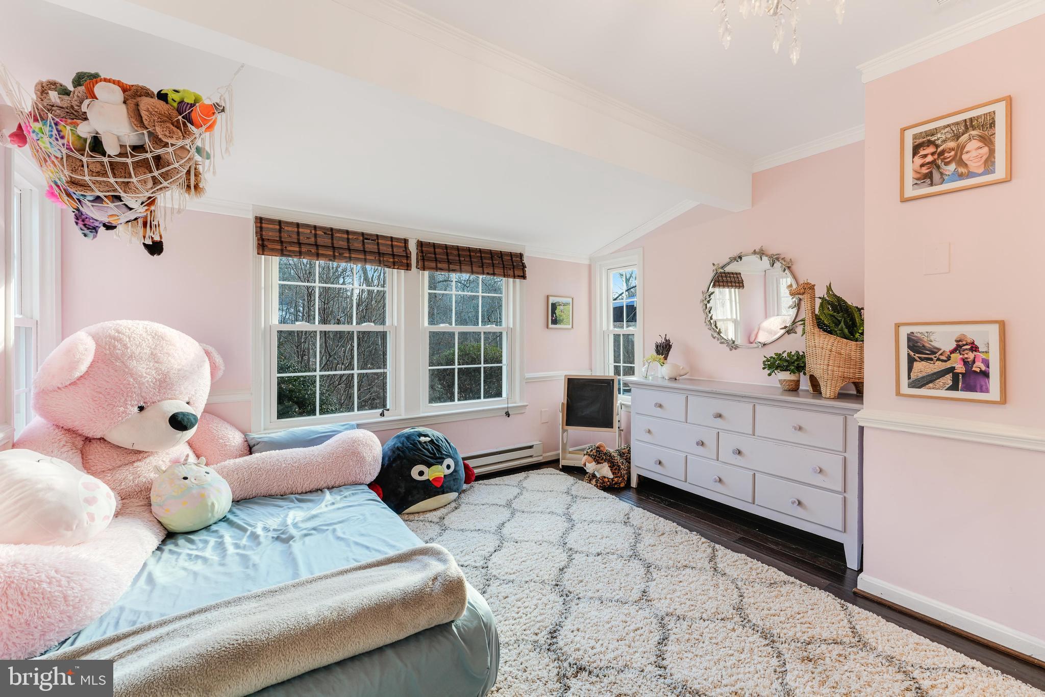 10808 Beach Mill Road Great Falls, VA 22066 - Photo 29 of 43 a bedroom with a bed and a window