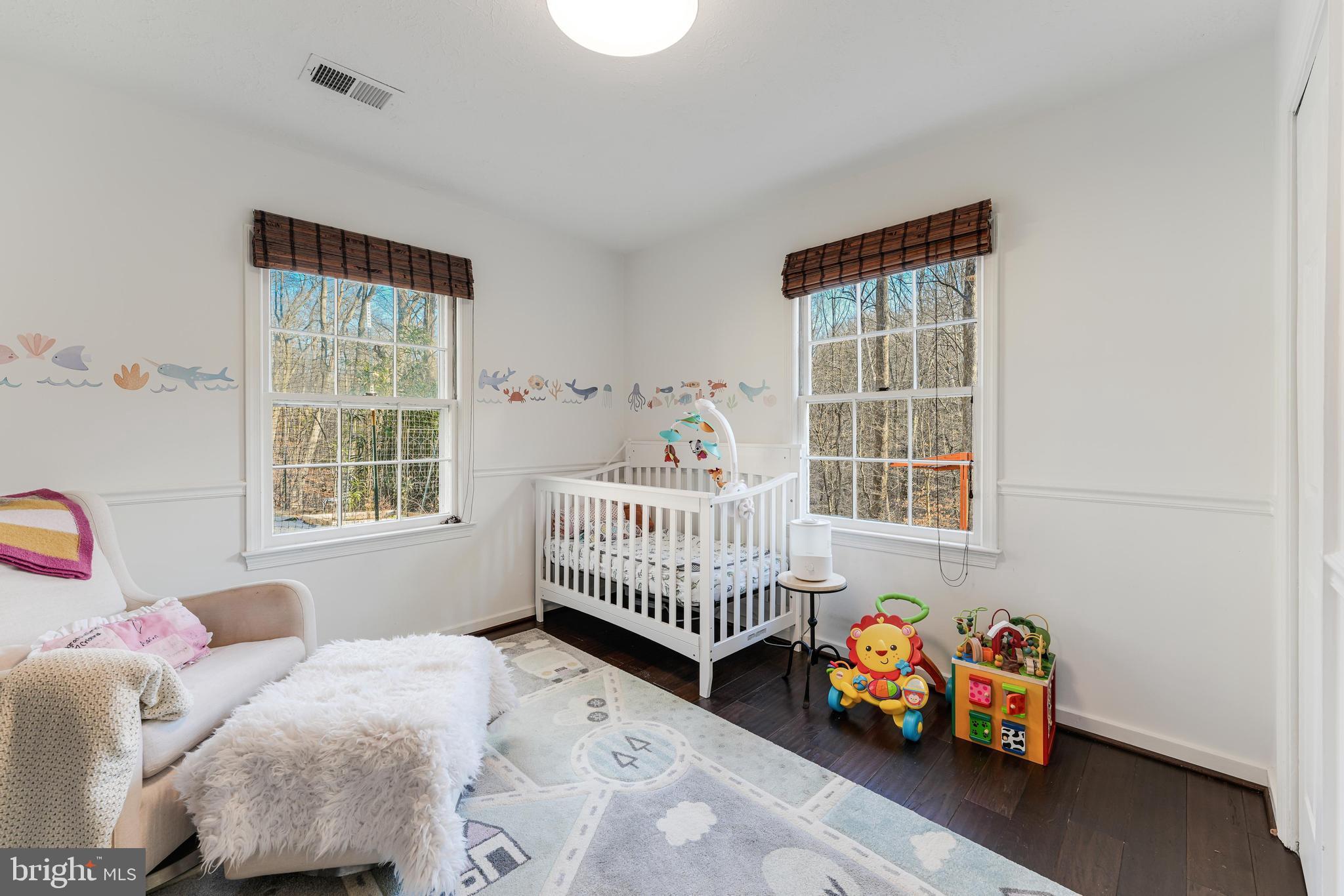10808 Beach Mill Road Great Falls, VA 22066 - Photo 32 of 43 a bedroom with bed and a window