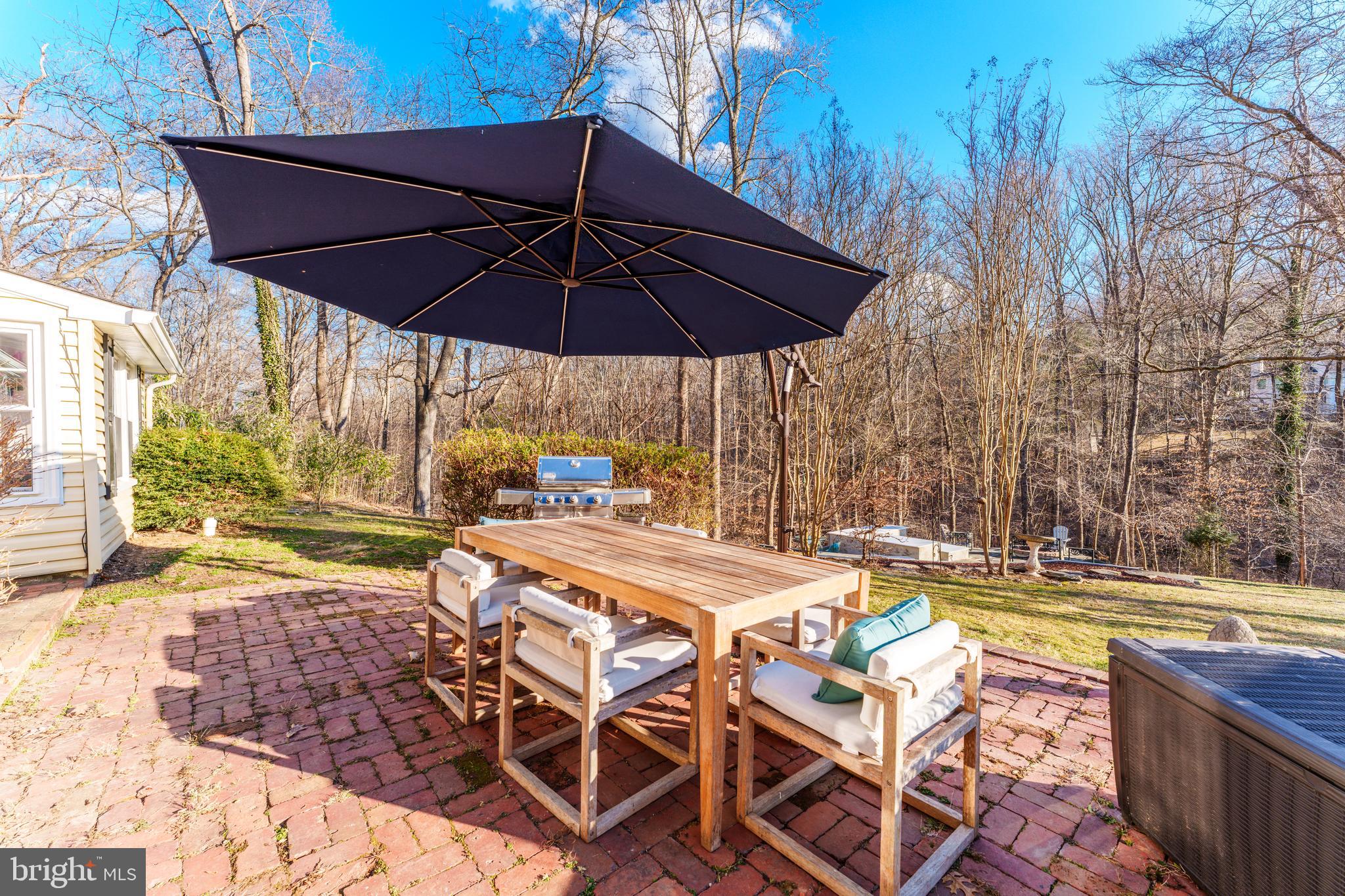 10808 Beach Mill Road Great Falls, VA 22066 - Photo 36 of 43 a view of a swimming pool with a patio
