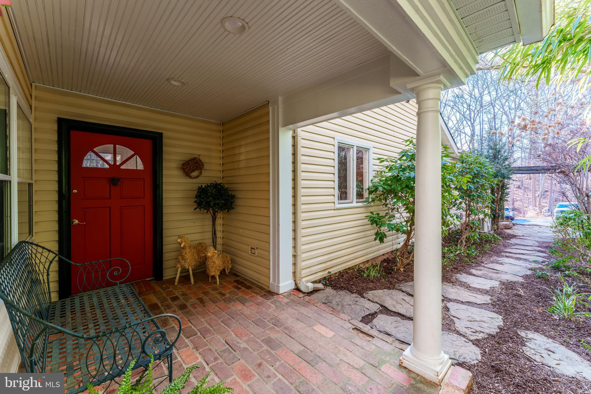 10808 Beach Mill Road Great Falls, VA 22066 - Photo 4 of 43 a view of a house with backyard and trees