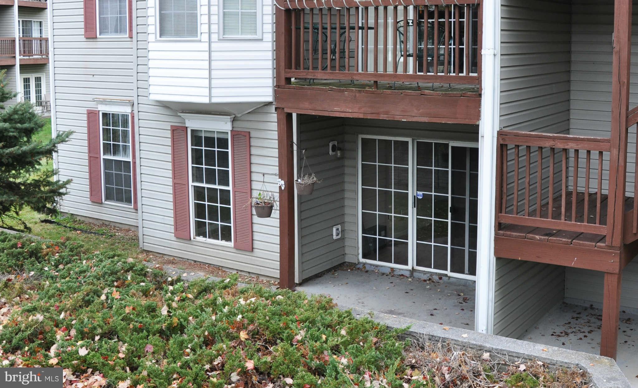 114 Timberlake Terrace, Unit 2 Stephens City, VA 22655 - Photo 2 of 22 a view of a house with a large window and wooden fence