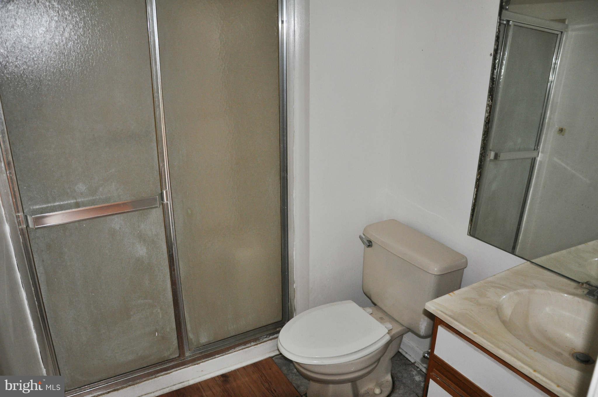 114 Timberlake Terrace, Unit 2 Stephens City, VA 22655 - Photo 17 of 22 a white toilet sitting next to a shower