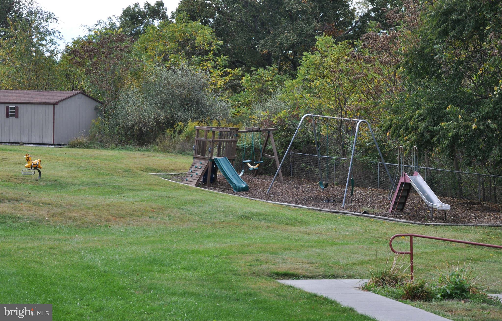 114 Timberlake Terrace, Unit 2 Stephens City, VA 22655 - Photo 20 of 22 a view of a backyard with a slide