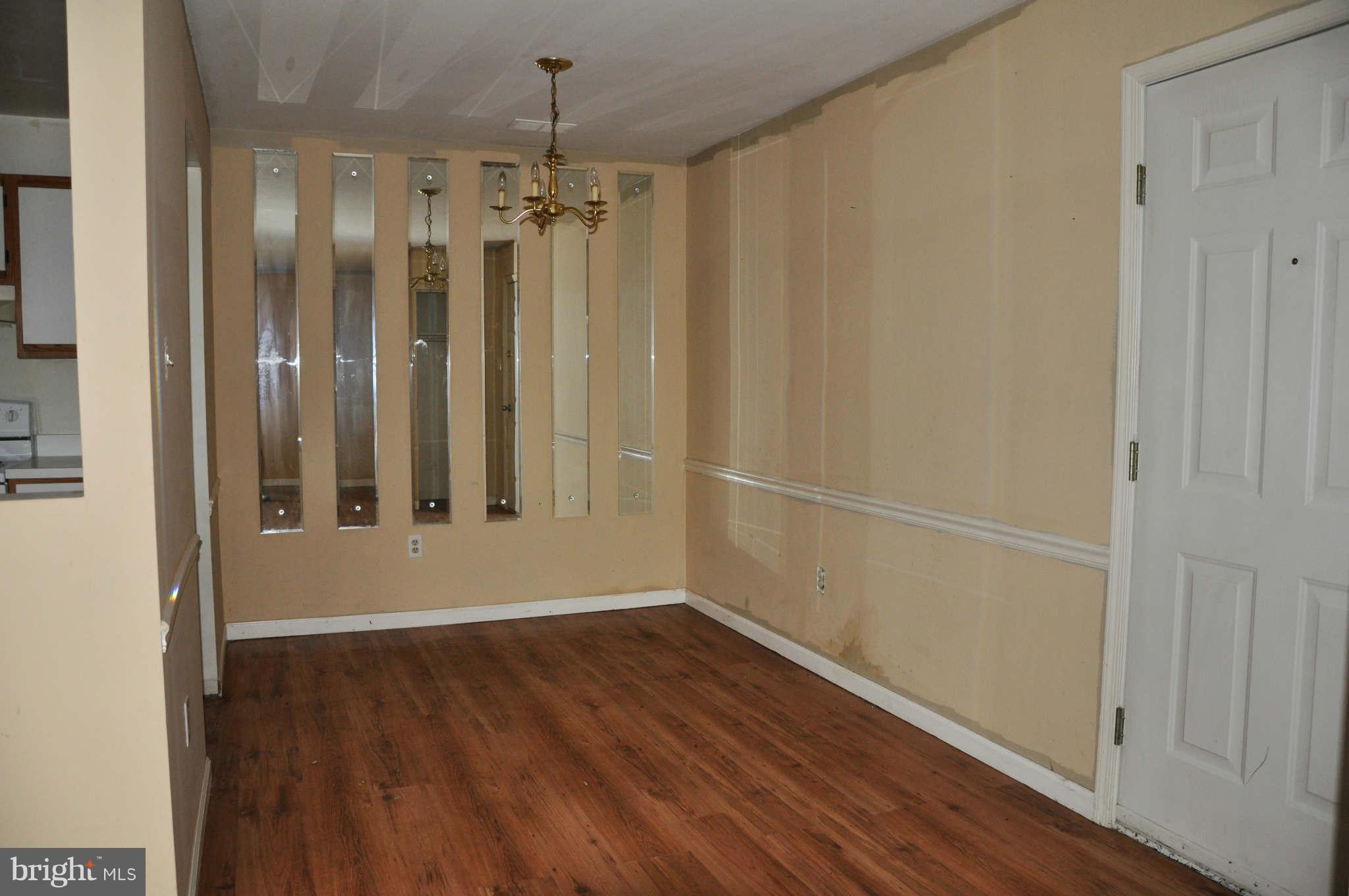 114 Timberlake Terrace, Unit 2 Stephens City, VA 22655 - Photo 5 of 22 a view of a hallway with wooden floor and staircase