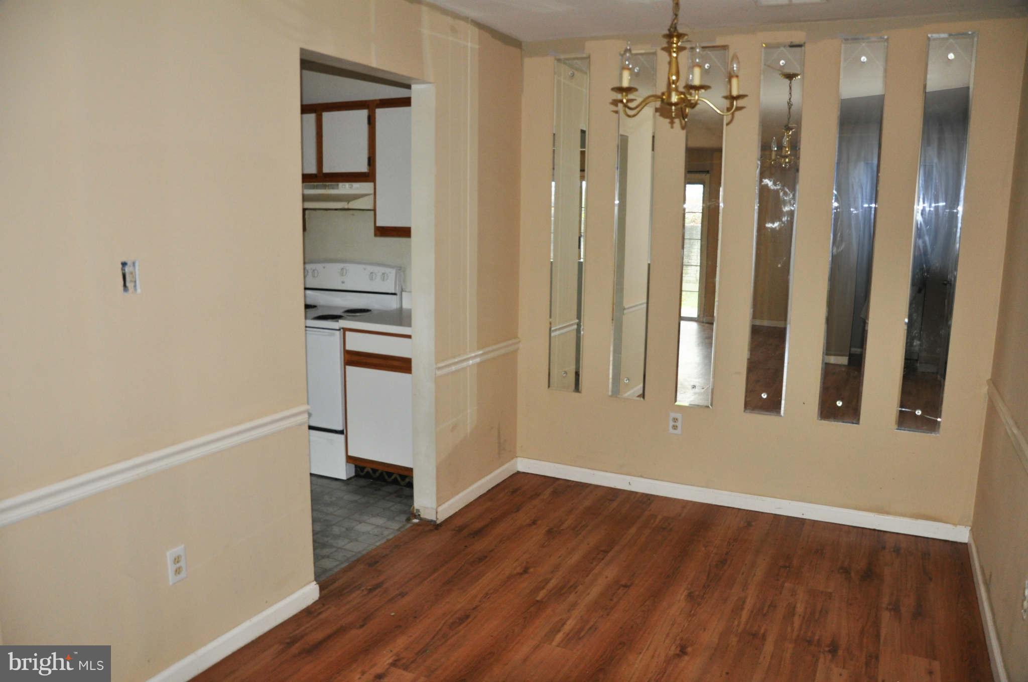 114 Timberlake Terrace, Unit 2 Stephens City, VA 22655 - Photo 6 of 22 a view of a hallway with wooden floor and staircase