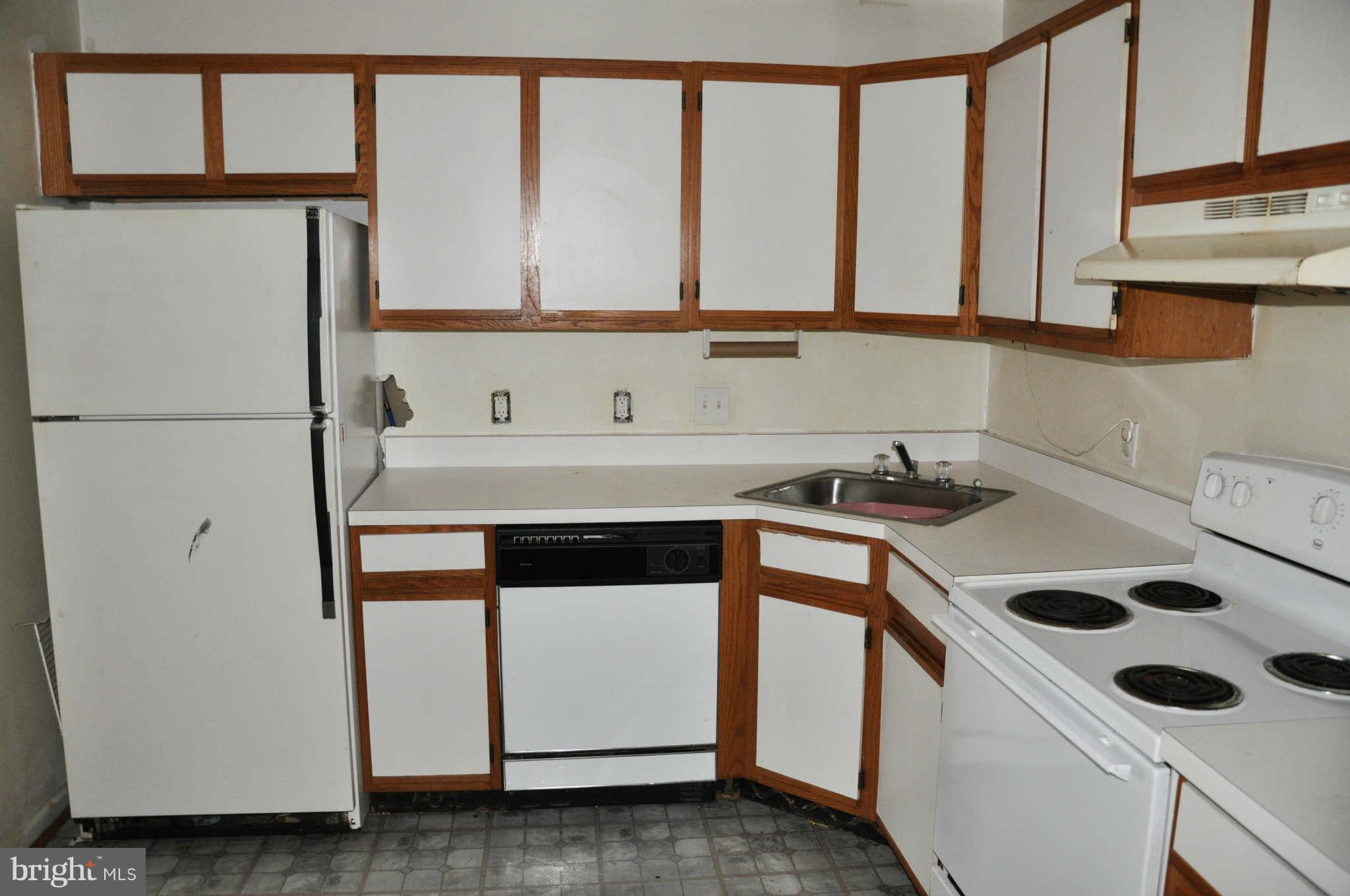 114 Timberlake Terrace, Unit 2 Stephens City, VA 22655 - Photo 7 of 22 a kitchen with a white stove top oven and sink