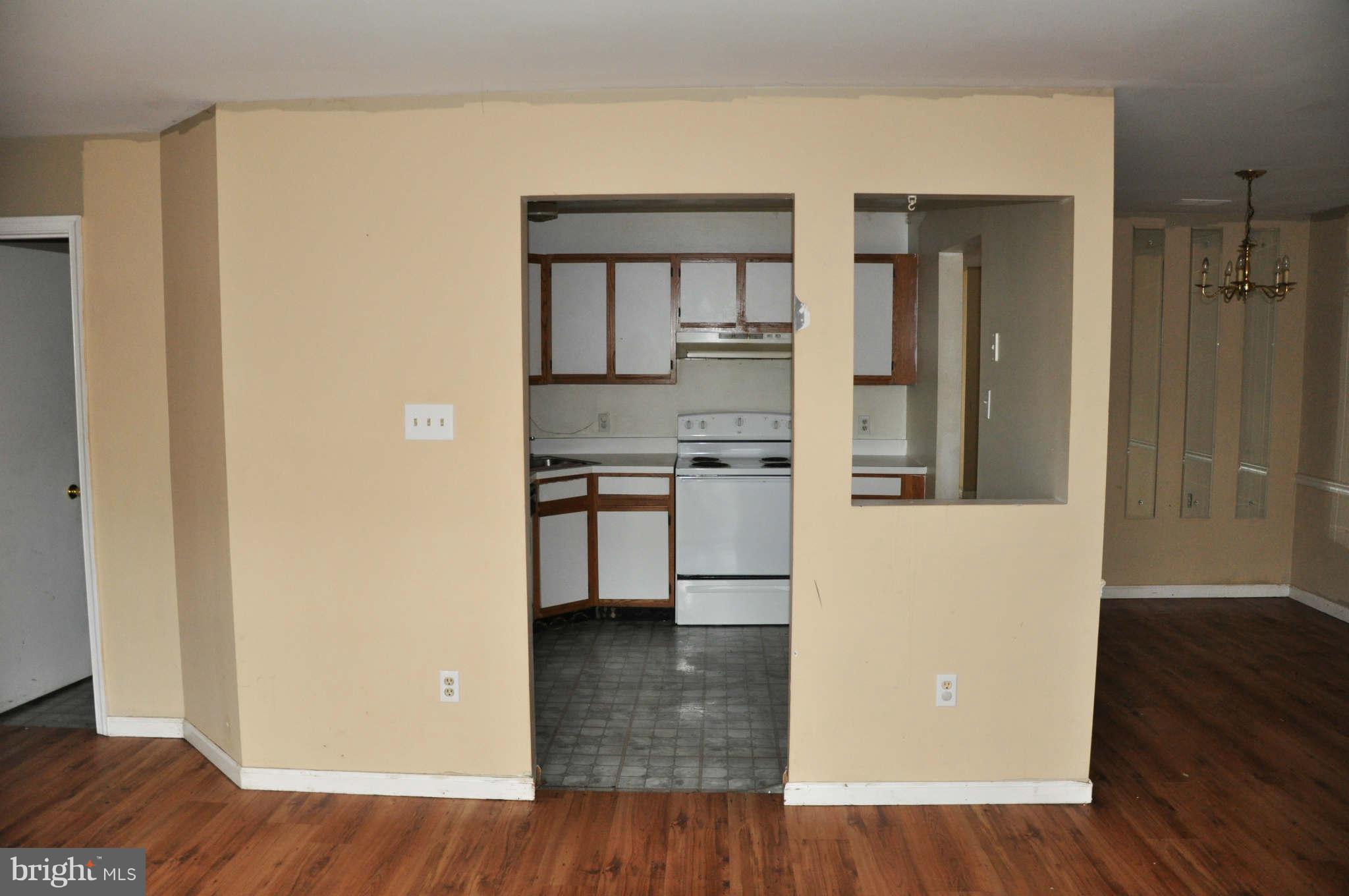 114 Timberlake Terrace, Unit 2 Stephens City, VA 22655 - Photo 9 of 22 a view of kitchen with furniture and wooden floor