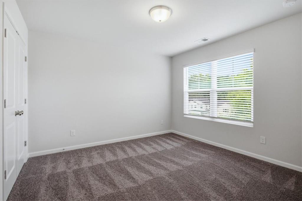 585 Summit Point Canton, GA 30114 - Photo 19 of 30 a view of an empty room with a window
