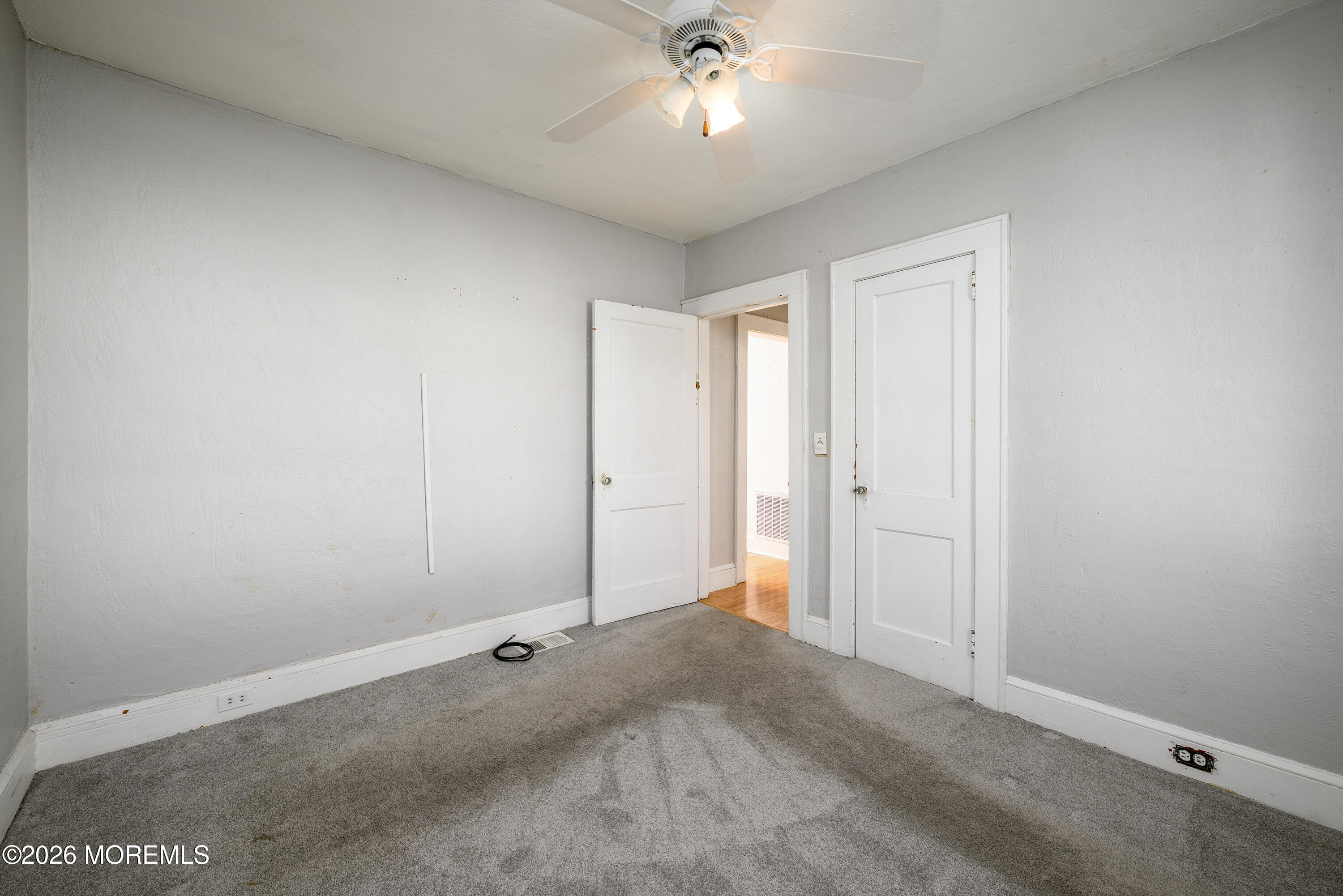 154 Lower Main Street Aberdeen, NJ 07747 - Photo 12 of 22 a view of a livingroom with a ceiling fan and window