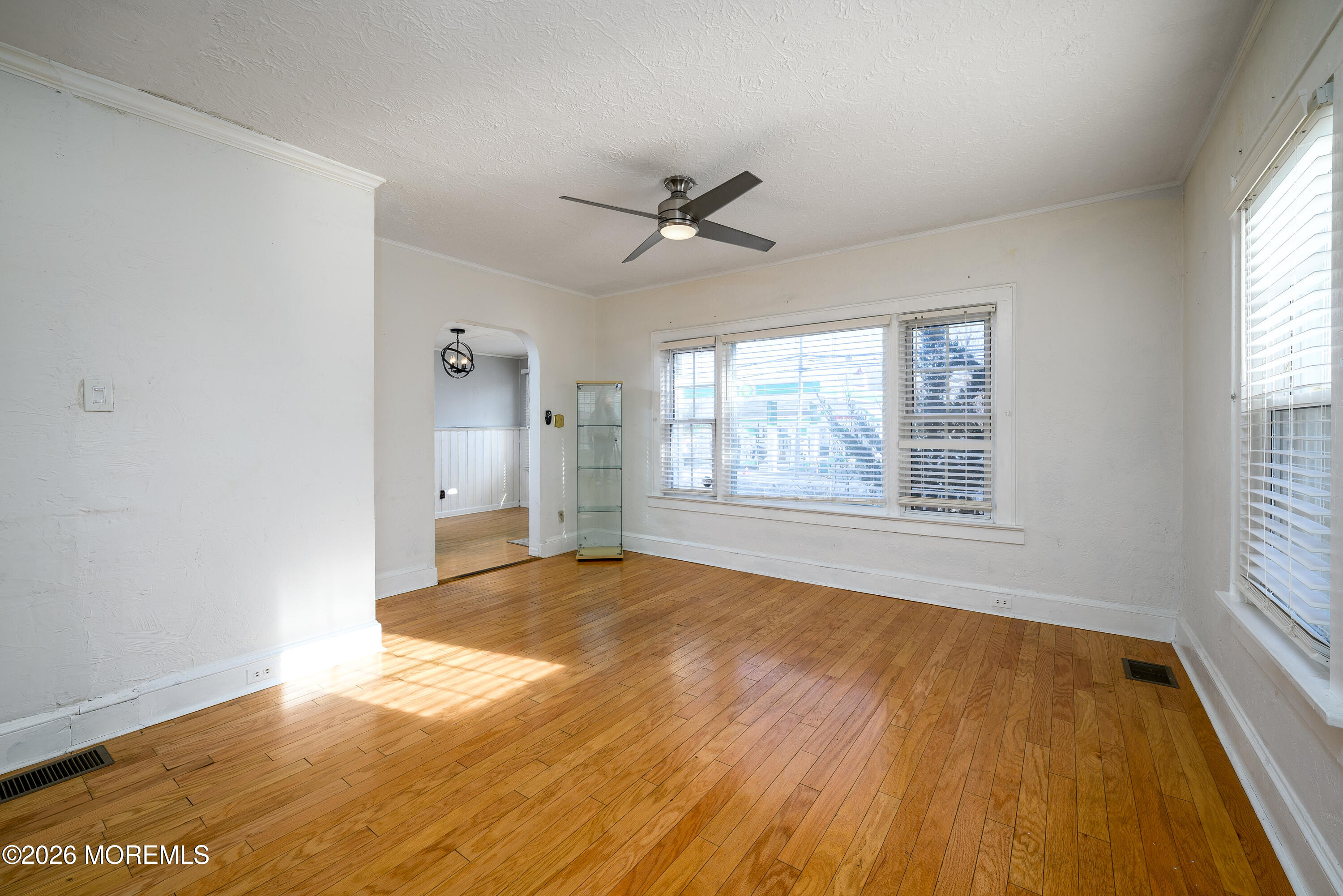 154 Lower Main Street Aberdeen, NJ 07747 - Photo 4 of 22 wooden floor in an empty room with a window