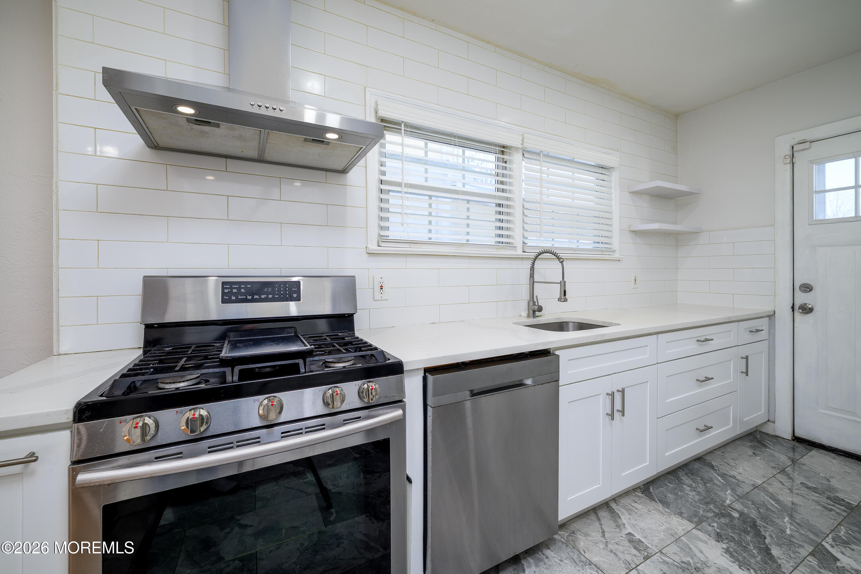 154 Lower Main Street Aberdeen, NJ 07747 - Photo 8 of 22 a kitchen with cabinets and appliances