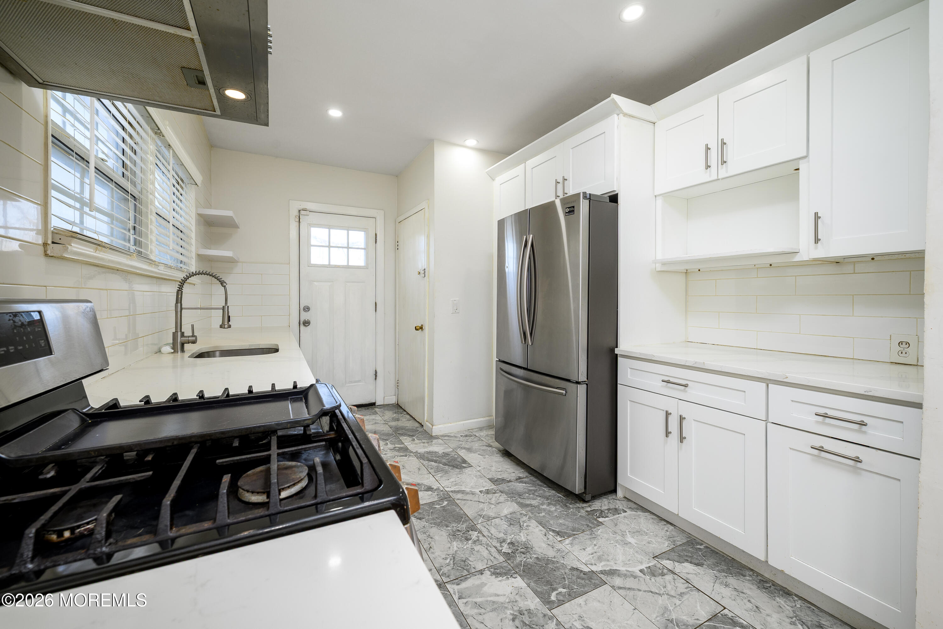 154 Lower Main Street Aberdeen, NJ 07747 - Photo 9 of 22 a kitchen with a stove and a refrigerator