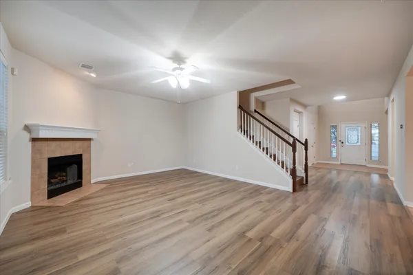 a large kitchen with stainless steel appliances a stove a sink a counter top space and cabinets