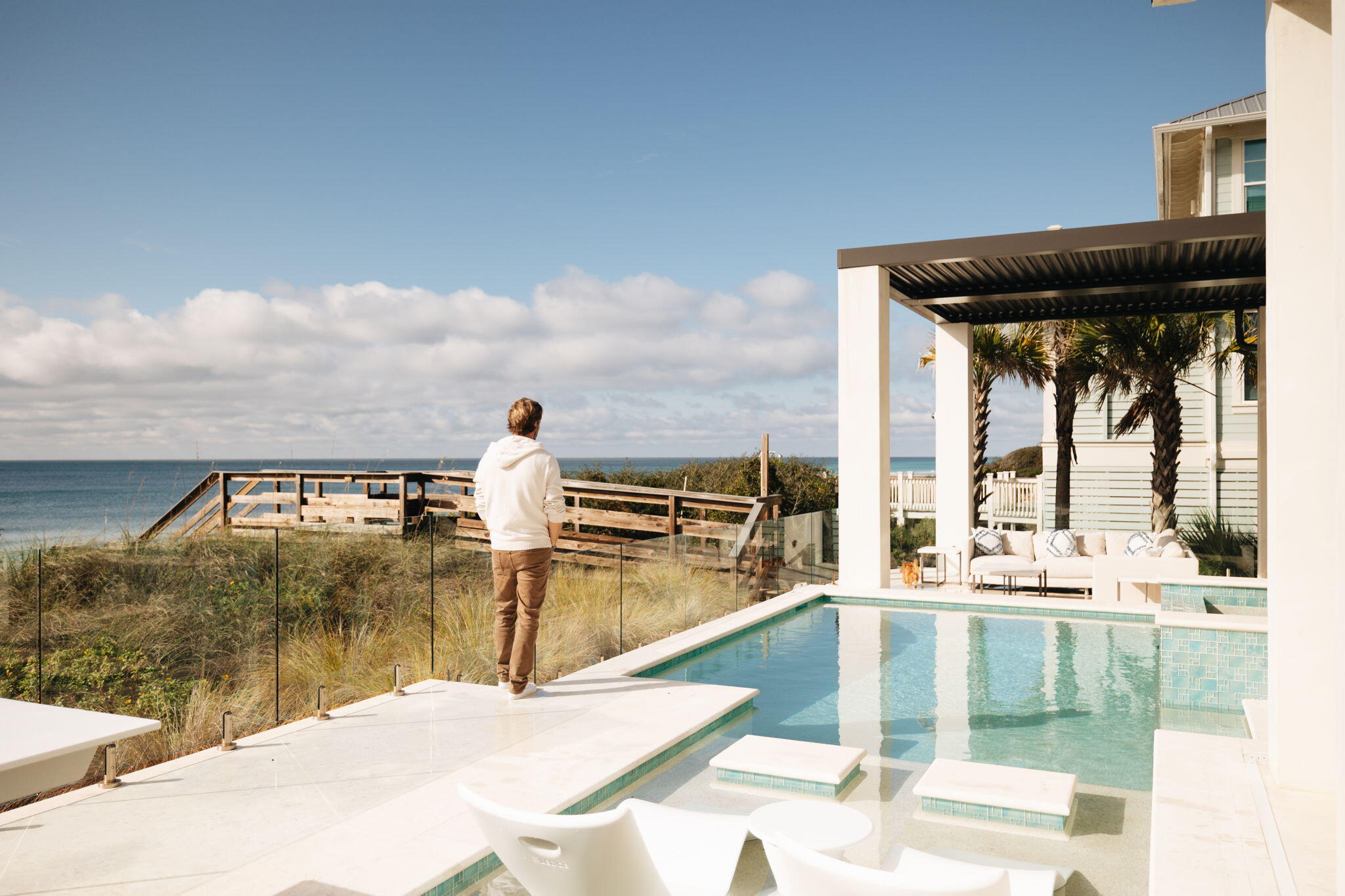 a view of a swimming pool with an outdoor seating