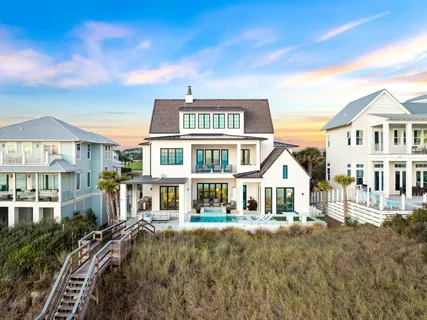 a front view of a residential apartment building with a yard