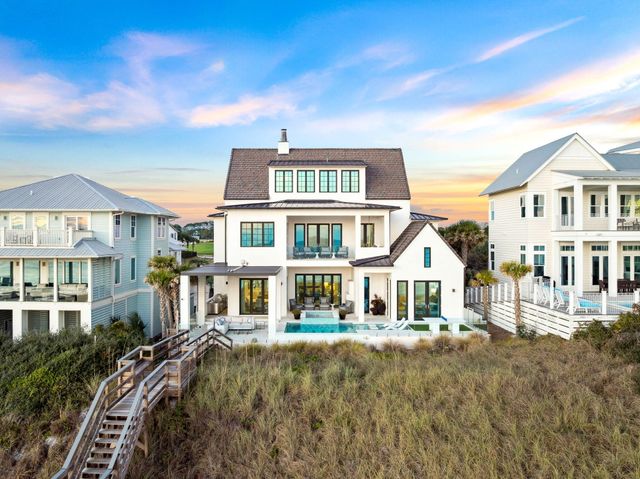 a front view of a residential apartment building with a yard