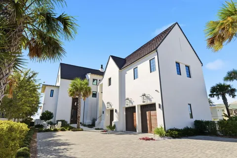 a view of a patio with swimming pool table and chairs